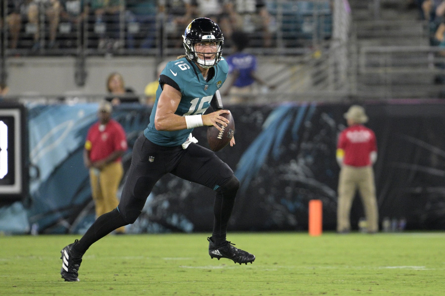 Jacksonville Jaguars quarterback Trevor Lawrence (16) scrambles for yardage during the first half of a preseason NFL football game against the Pittsburgh Steelers, Saturday, Aug. 20, 2022, in Jacksonville, Fla. (AP Photo/Phelan M. Ebenhack)