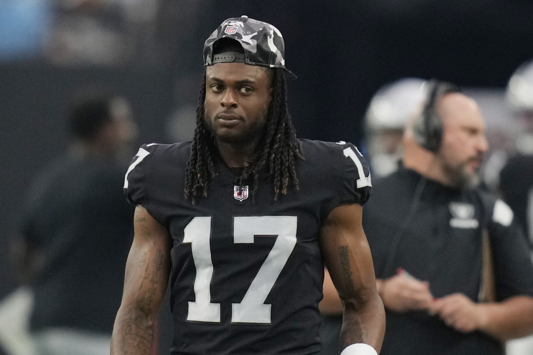 Las Vegas Raiders wide receiver Davante Adams (17) stands on the sideline during an NFL preseason football game against the New England Patriots, Friday, Aug. 26, 2022, in Las Vegas. (AP Photo/John Locher)