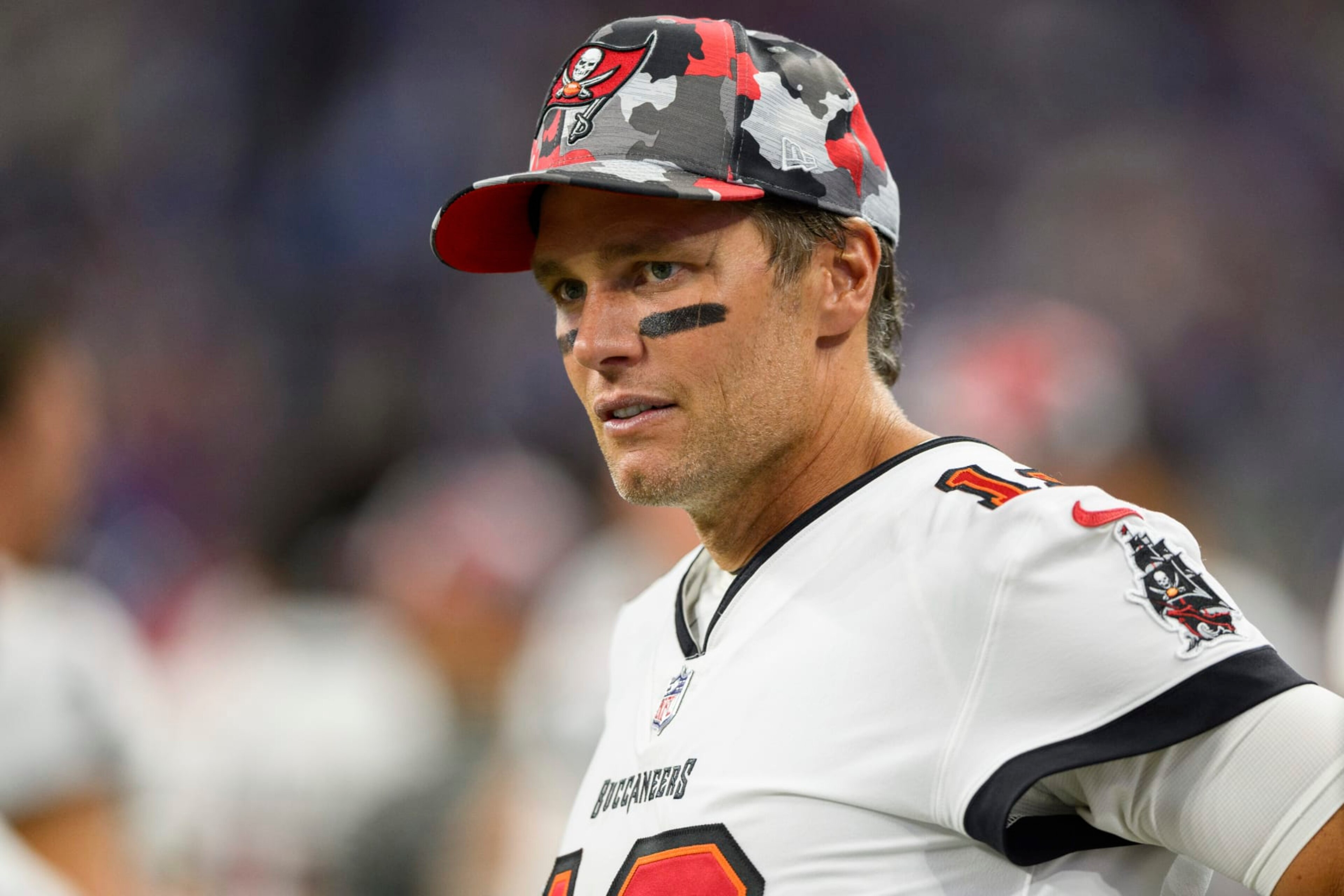 FILE - Tampa Bay Buccaneers quarterback Tom Brady (12) stands on the sideline during an NFL football game against the Indianapolis Colts, Aug. 27, 2022, in Indianapolis. A New Jersey man who posed as a former New England Patriots player in order to buy and sell Super Bowl rings that he claimed were gifts to Brady's family has been sentenced to three years in federal prison. (AP Photo/Zach Bolinger, File) FILE - Tampa Bay Buccaneers quarterback Tom Brady (12) stands on the sideline during an NFL football game against the Indianapolis Colts, Aug. 27, 2022, in Indianapolis. A New Jersey man who posed as a former New England Patriots player in order to buy and sell Super Bowl rings that he claimed were gifts to Brady's family has been sentenced to three years in federal prison. (AP Photo/Zach Bolinger, File)