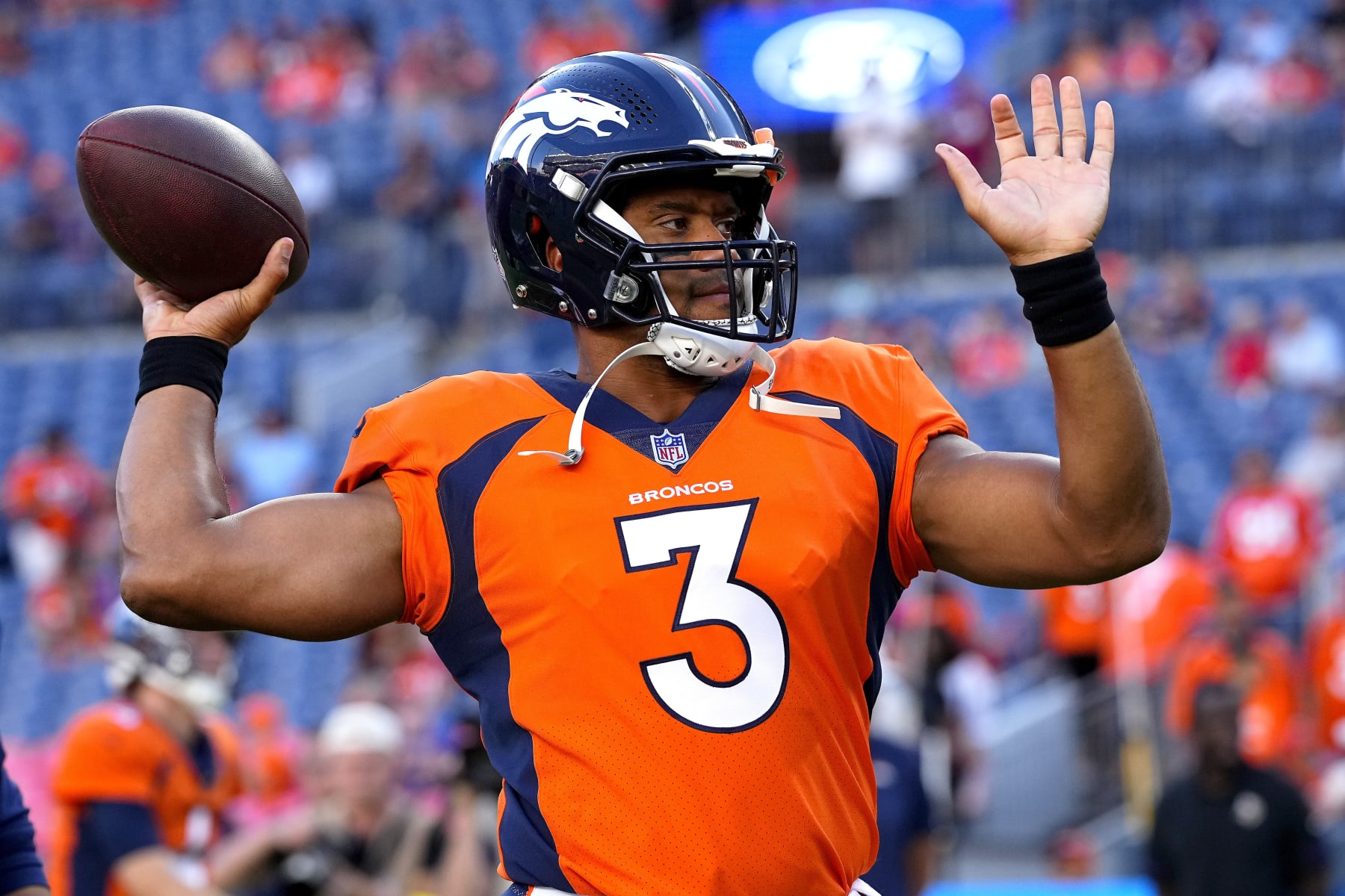 Denver Broncos quarterback Russell Wilson (3) warms up prior to an NFL preseason football game against the Minnesota Vikings, Saturday, Aug. 27, 2022, in Denver. (AP Photo/Jack Dempsey)
