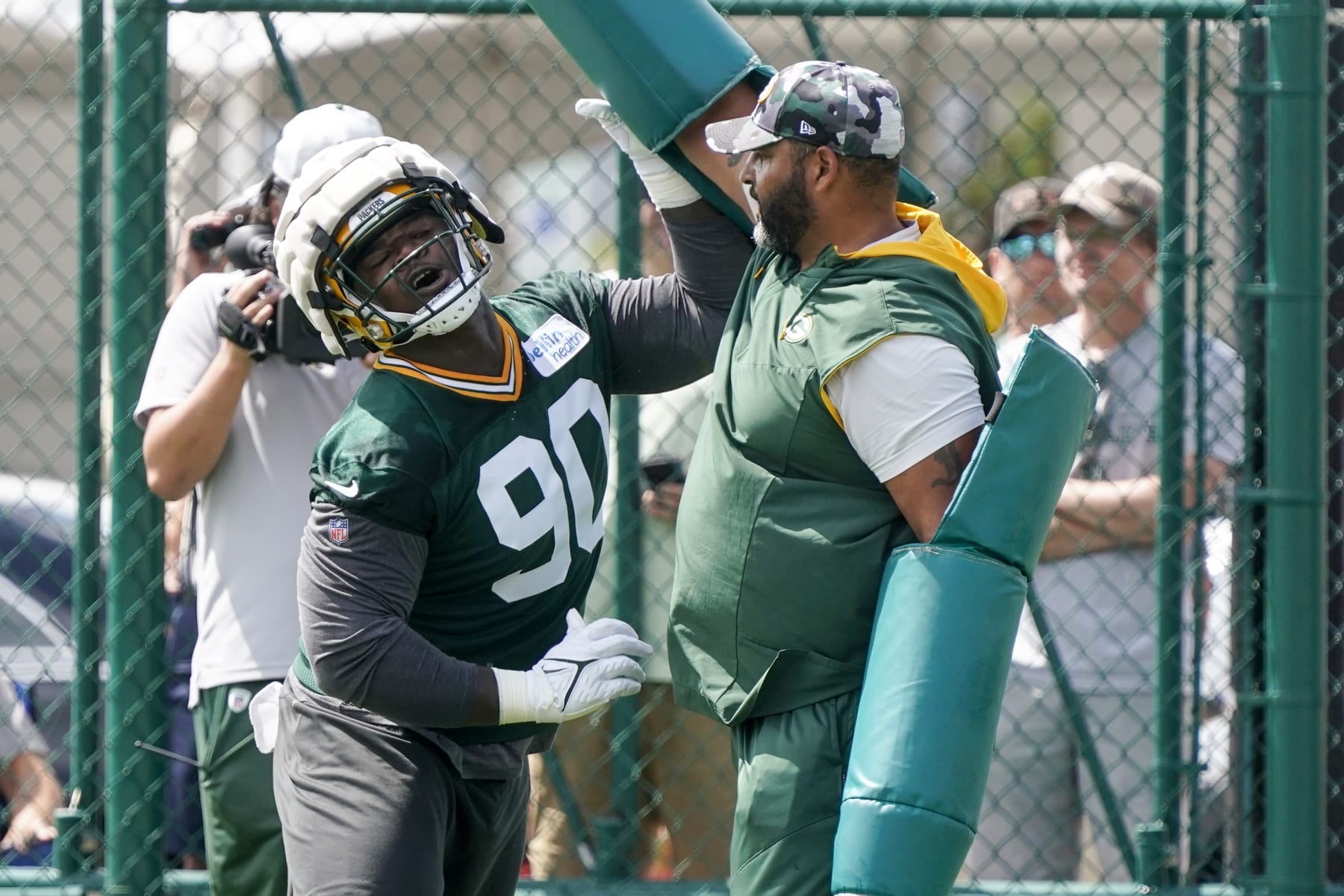 Green Bay Packers' Jarran Reed runs a drill at the NFL football team's practice field Wednesday, July 27, 2022, in Green Bay, Wis. (AP Photo/Morry Gash)