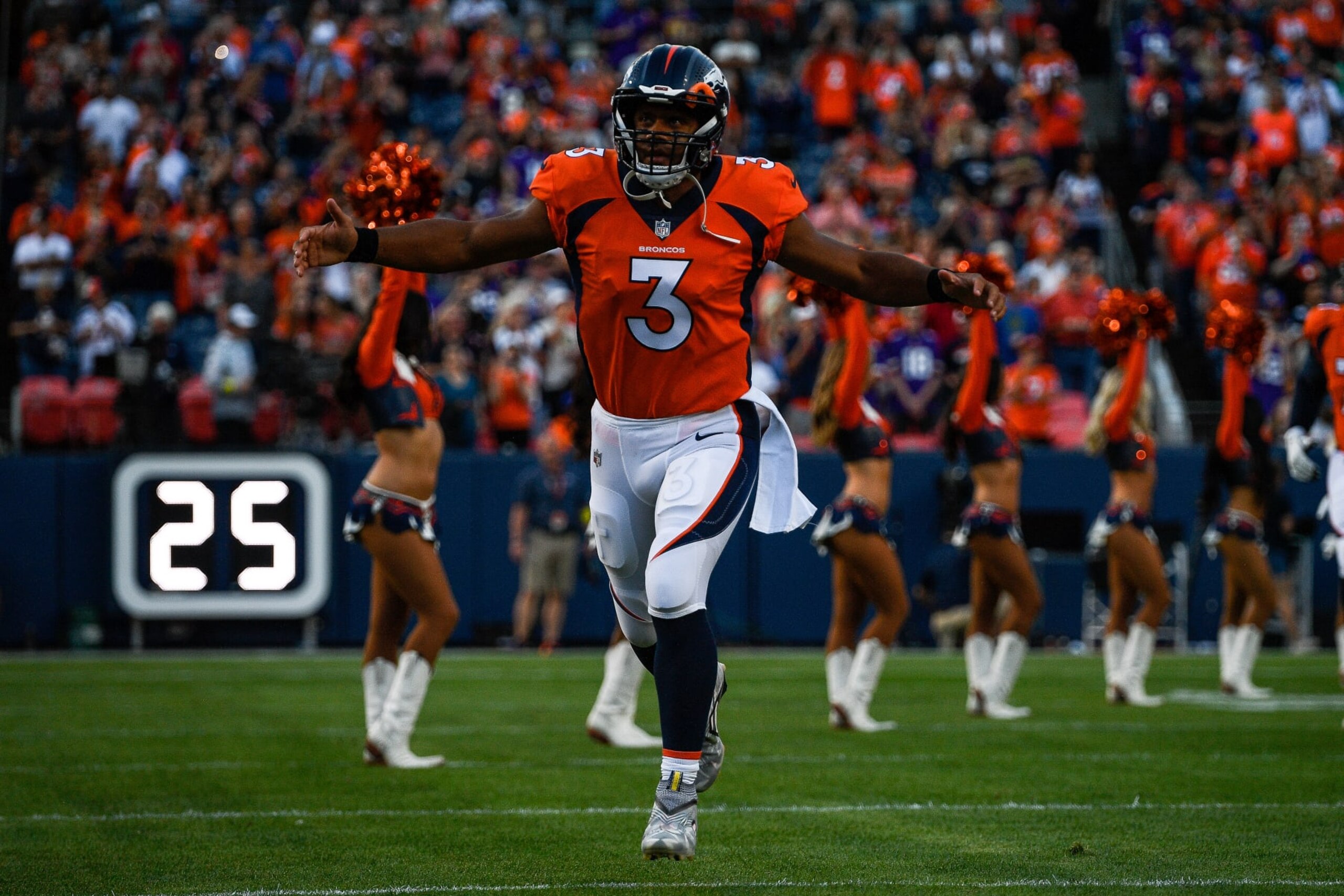 DENVER, COLORADO - AUGUST 27: Quarterback Russell Wilson #3 of the Denver Broncos runs onto the field before a preseason NFL game against the Minnesota Vikings at Empower Field at Mile High on August 27, 2022 in Denver, Colorado. (Photo by Dustin Bradford/Getty Images) DENVER, COLORADO - AUGUST 27: Quarterback Russell Wilson #3 of the Denver Broncos runs onto the field before a preseason NFL game against the Minnesota Vikings at Empower Field at Mile High on August 27, 2022 in Denver, Colorado. (Photo by Dustin Bradford/Getty Images)