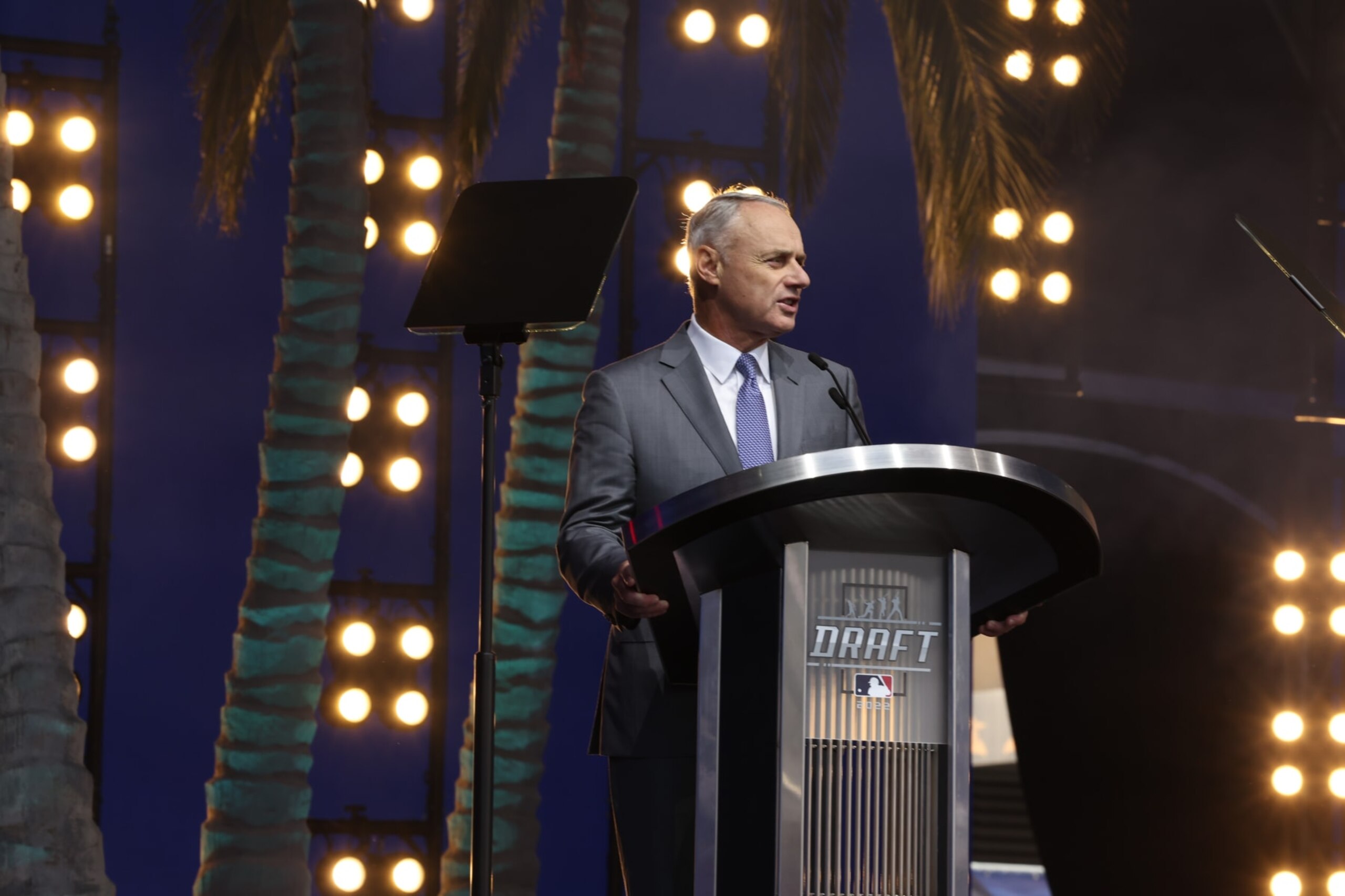 LOS ANGELES, CA - JULY 17: Major League Baseball Commissioner Robert D. Manfred Jr. speaks at the podium during the 2022 Major League Baseball Draft at L.A. Live on Sunday, July 17, 2022 in Los Angeles, California. (Photo by Mary DeCicco/MLB Photos via Getty Images) LOS ANGELES, CA - JULY 17: Major League Baseball Commissioner Robert D. Manfred Jr. speaks at the podium during the 2022 Major League Baseball Draft at L.A. Live on Sunday, July 17, 2022 in Los Angeles, California. (Photo by Mary DeCicco/MLB Photos via Getty Images)