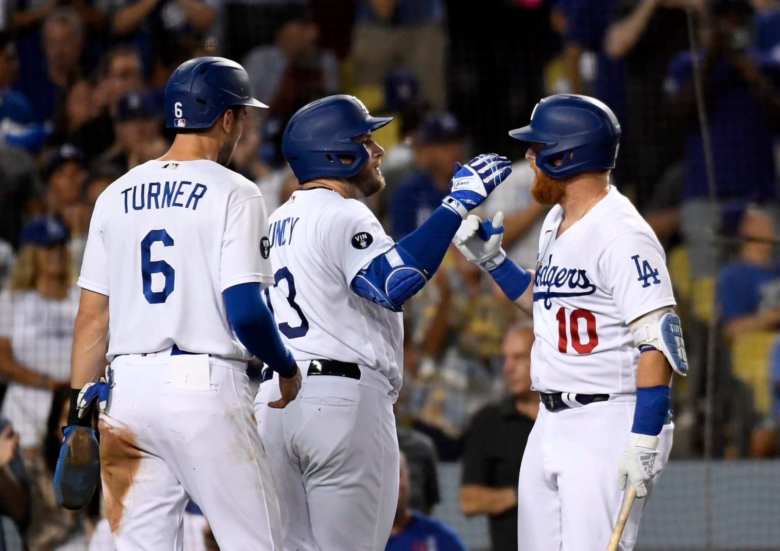 LOS ANGELES, CA - SEPTEMBER 06: Max Muncy #13 of the Los Angeles Dodgers celebrates his two-run home run with Trea Turner #6 and Justin Turner #10 in the third inning against the San Francisco Giants at Dodger Stadium on September 6, 2022 in Los Angeles, California. (Photo by Kevork Djansezian/Getty Images)