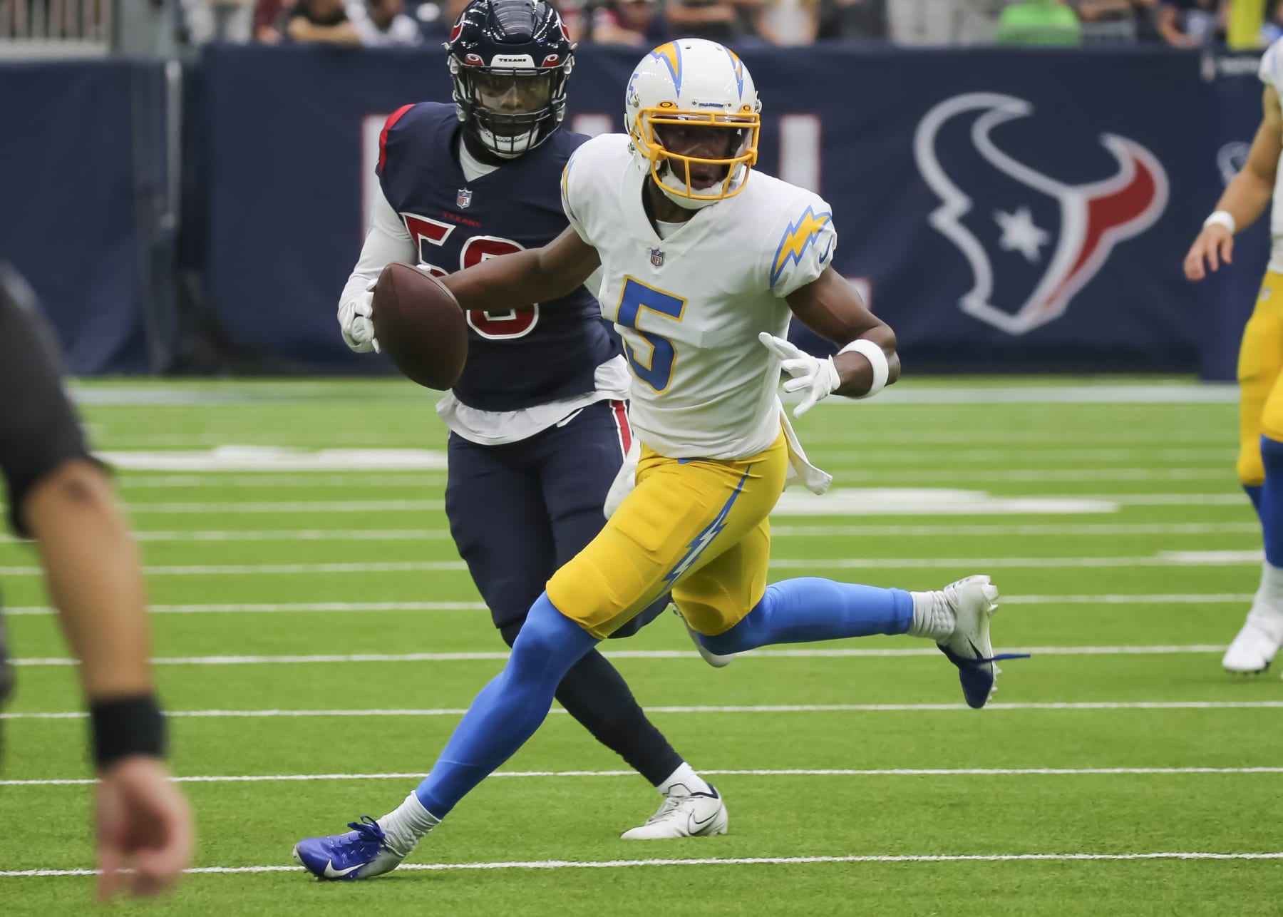 HOUSTON, TX - DECEMBER 26:  Los Angeles Chargers wide receiver Josh Palmer (5) carries the ball in the second quarter during the NFL game between the Los Angeles Chargers and Houston Texans on December 26, 2021 at NRG Stadium in Houston, Texas.  (Photo by Leslie Plaza Johnson/Icon Sportswire via Getty Images)