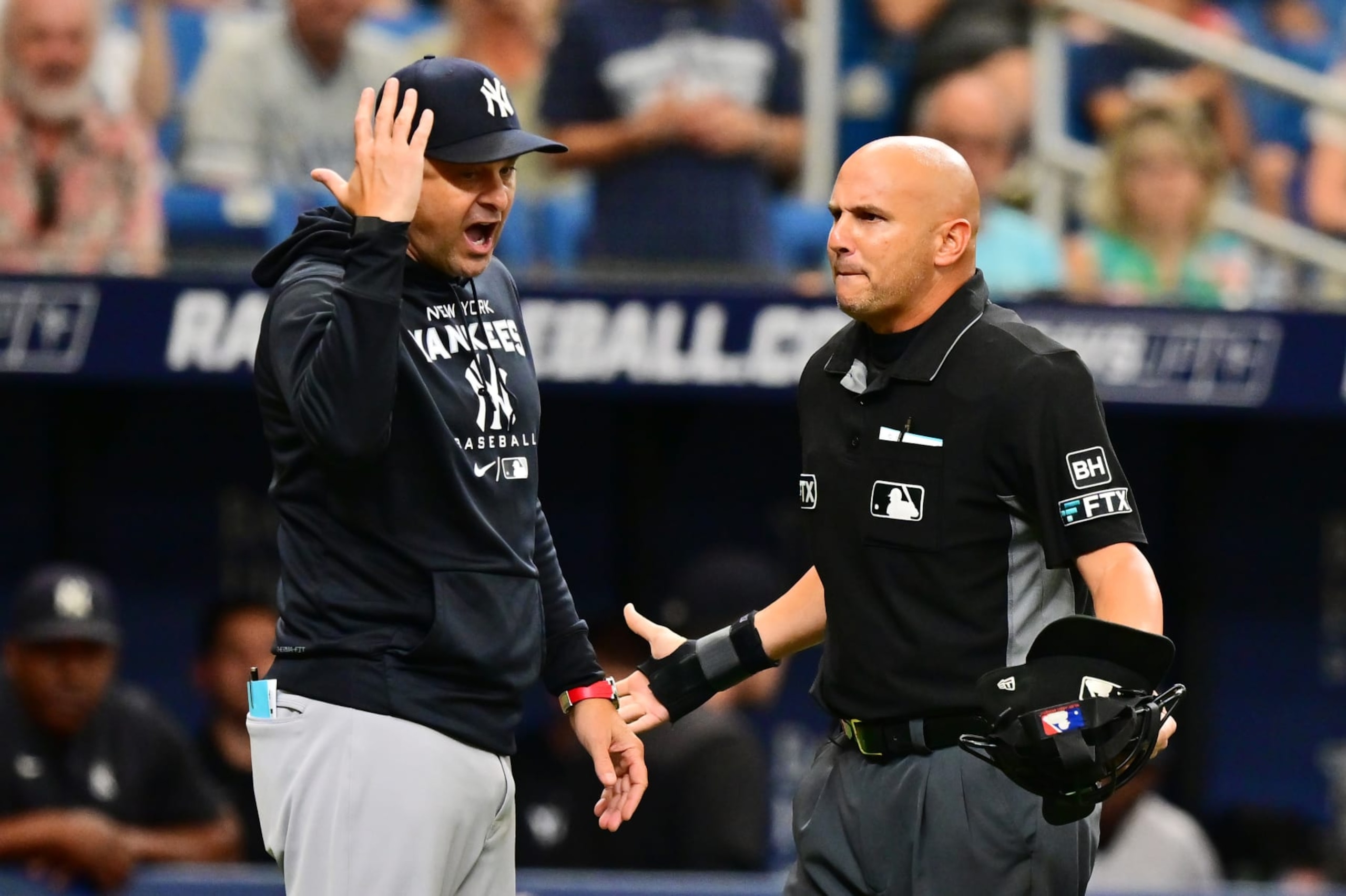 ST PETERSBURG, FLORIDA - SEPTEMBER 04: Aaron Boone #17 of the New York Yankees argues with umpire Vic Carapazza #19 before getting ejected in the fifth inning against the Tampa Bay Rays at Tropicana Field on September 04, 2022 in St Petersburg, Florida. (Photo by Julio Aguilar/Getty Images)