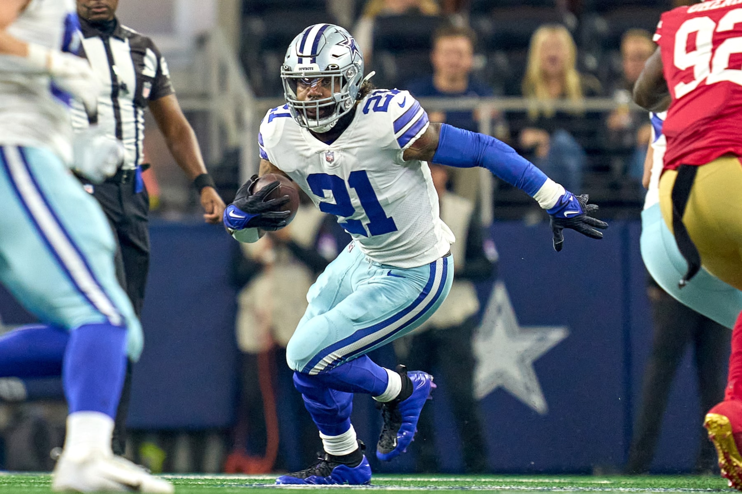 ARLINGTON, TX - JANUARY 16: Dallas Cowboys running back Ezekiel Elliott (21) runs with the football during the NFC Wild Card game between the San Francisco 49ers and the Dallas Cowboys on January 16, 2022 at AT&T Stadium in Arlington, TX. (Photo by Robin Alam/Icon Sportswire via Getty Images) ARLINGTON, TX - JANUARY 16: Dallas Cowboys running back Ezekiel Elliott (21) runs with the football during the NFC Wild Card game between the San Francisco 49ers and the Dallas Cowboys on January 16, 2022 at AT&T Stadium in Arlington, TX. (Photo by Robin Alam/Icon Sportswire via Getty Images)