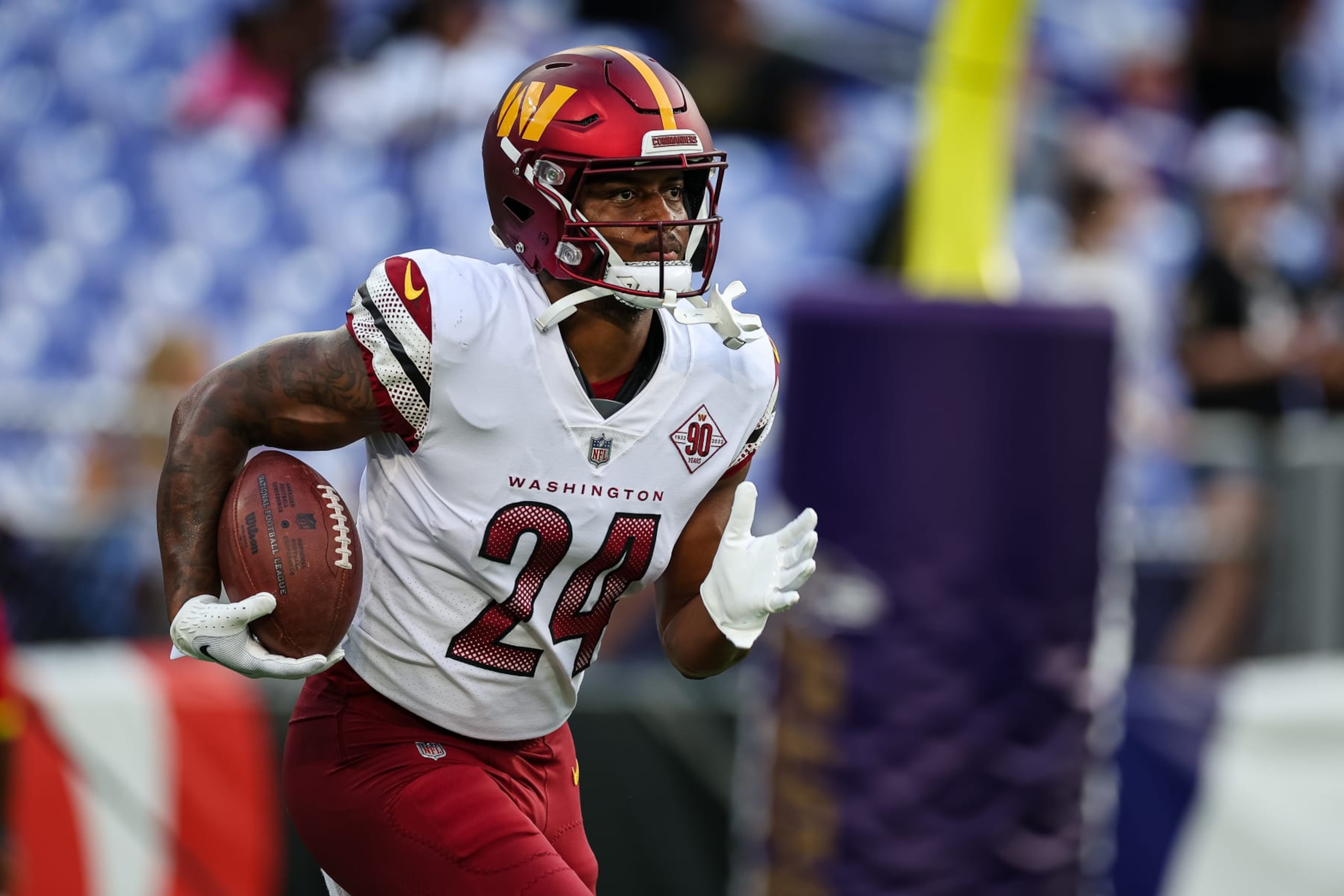 BALTIMORE, MD - AUGUST 27: Antonio Gibson #24 of the Washington Commanders warms up before the preseason game against the Baltimore Ravens at M&T Bank Stadium on August 27, 2022 in Baltimore, Maryland. (Photo by Scott Taetsch/Getty Images)
