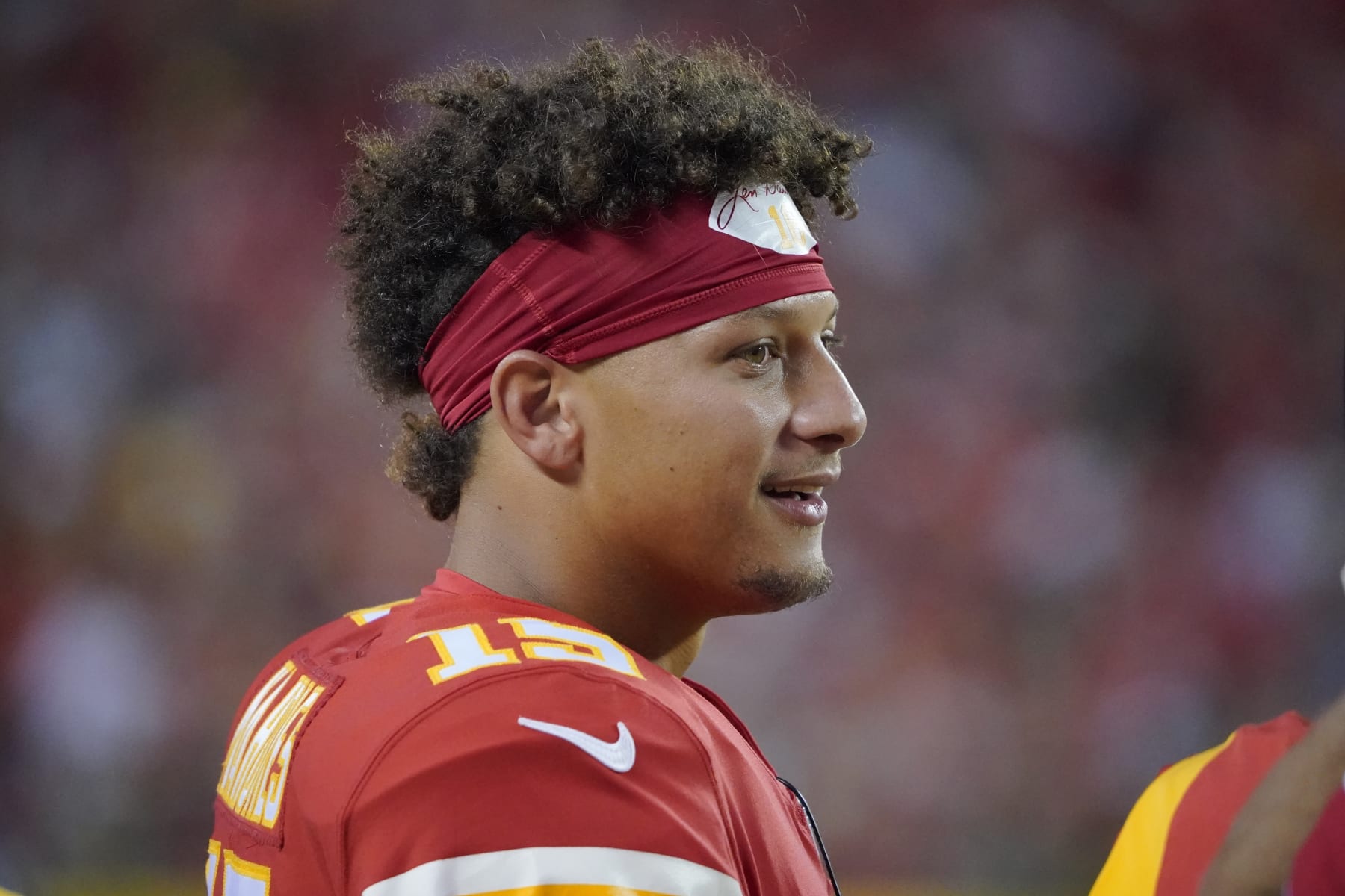 Kansas City Chiefs quarterback Patrick Mahomes watches from the sidelines during the first half of an NFL preseason football game against the Green Bay Packers Thursday, Aug. 25, 2022, in Kansas City, Mo. (AP Photo/Ed Zurga)