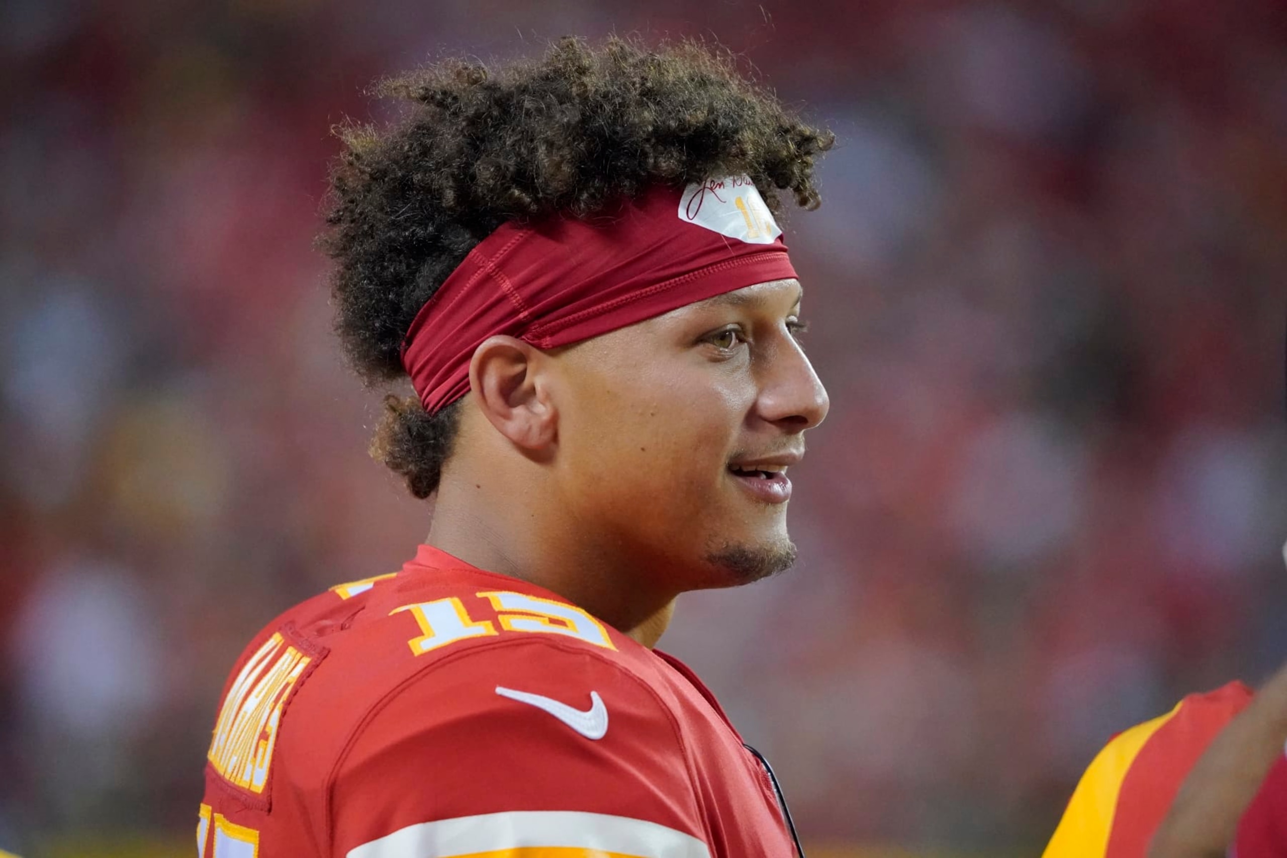 Kansas City Chiefs quarterback Patrick Mahomes watches from the sidelines during the first half of an NFL preseason football game against the Green Bay Packers Thursday, Aug. 25, 2022, in Kansas City, Mo. (AP Photo/Ed Zurga)