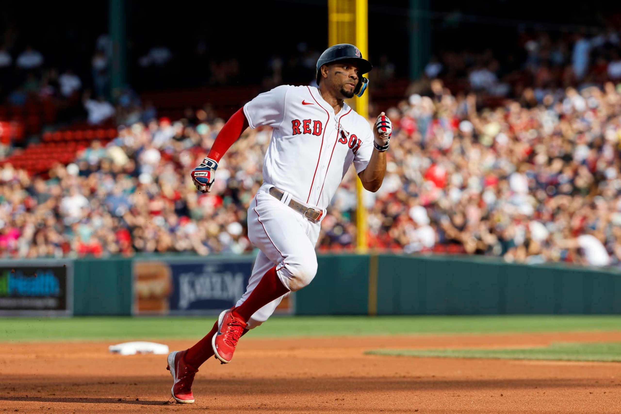 BOSTON, MA - SEPTEMBER 3: Xander Bogaerts #2 of the Boston Red Sox rounds the bases to score on a double hit by teammate Rafael Devers during the first inning against the Texas Rangers at Fenway Park on September 3, 2022 in Boston, Massachusetts. (Photo By Winslow Townson/Getty Images)