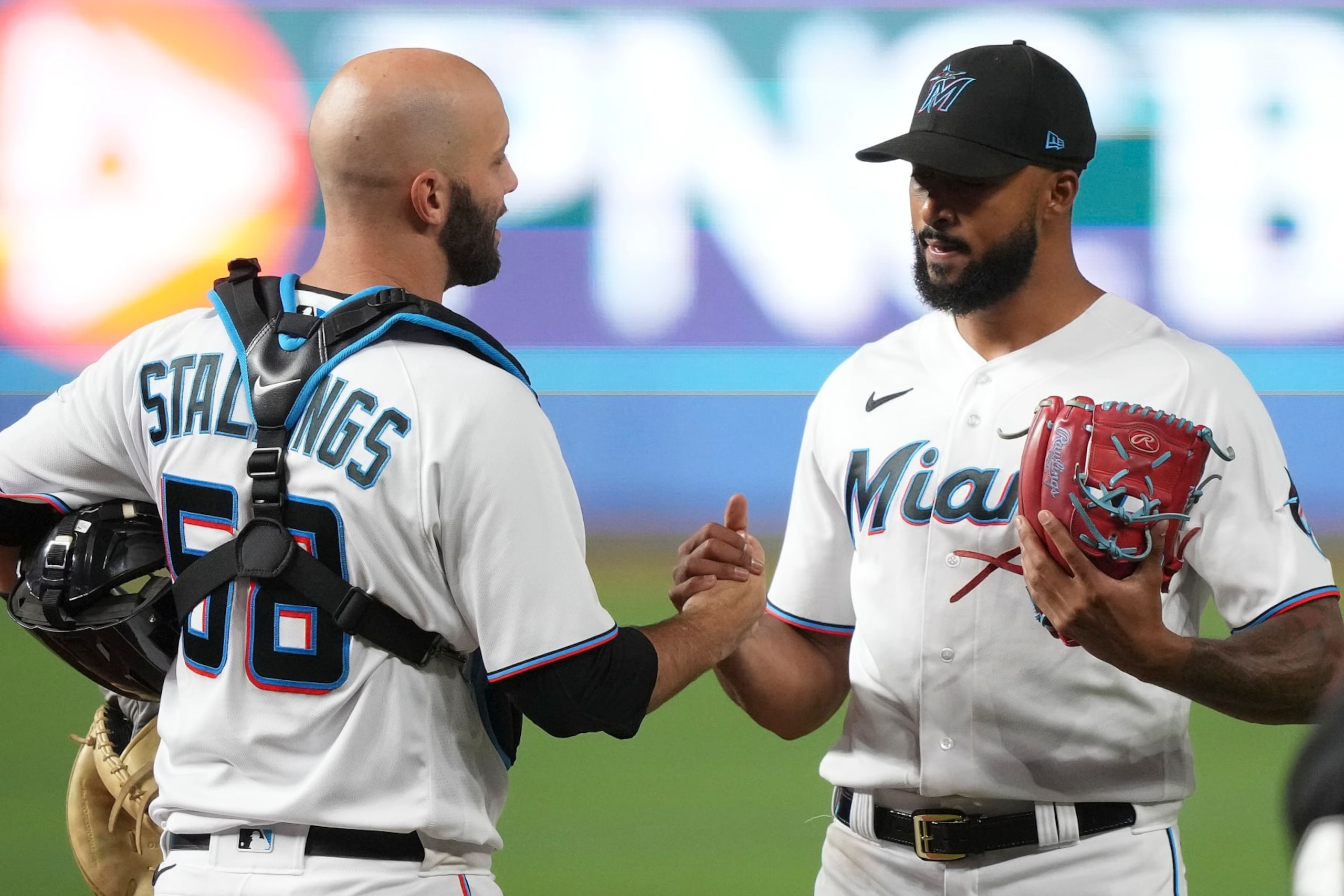 MIAMI, FLORIDA - AUGUST 03: Sandy Alcantara #22 of the Miami Marlins is congratulated by catcher Jacob Stallings #58 after throwing a complete game shutout against the Cincinnati Reds at loanDepot park on August 03, 2022 in Miami, Florida. (Photo by Eric Espada/Getty Images)