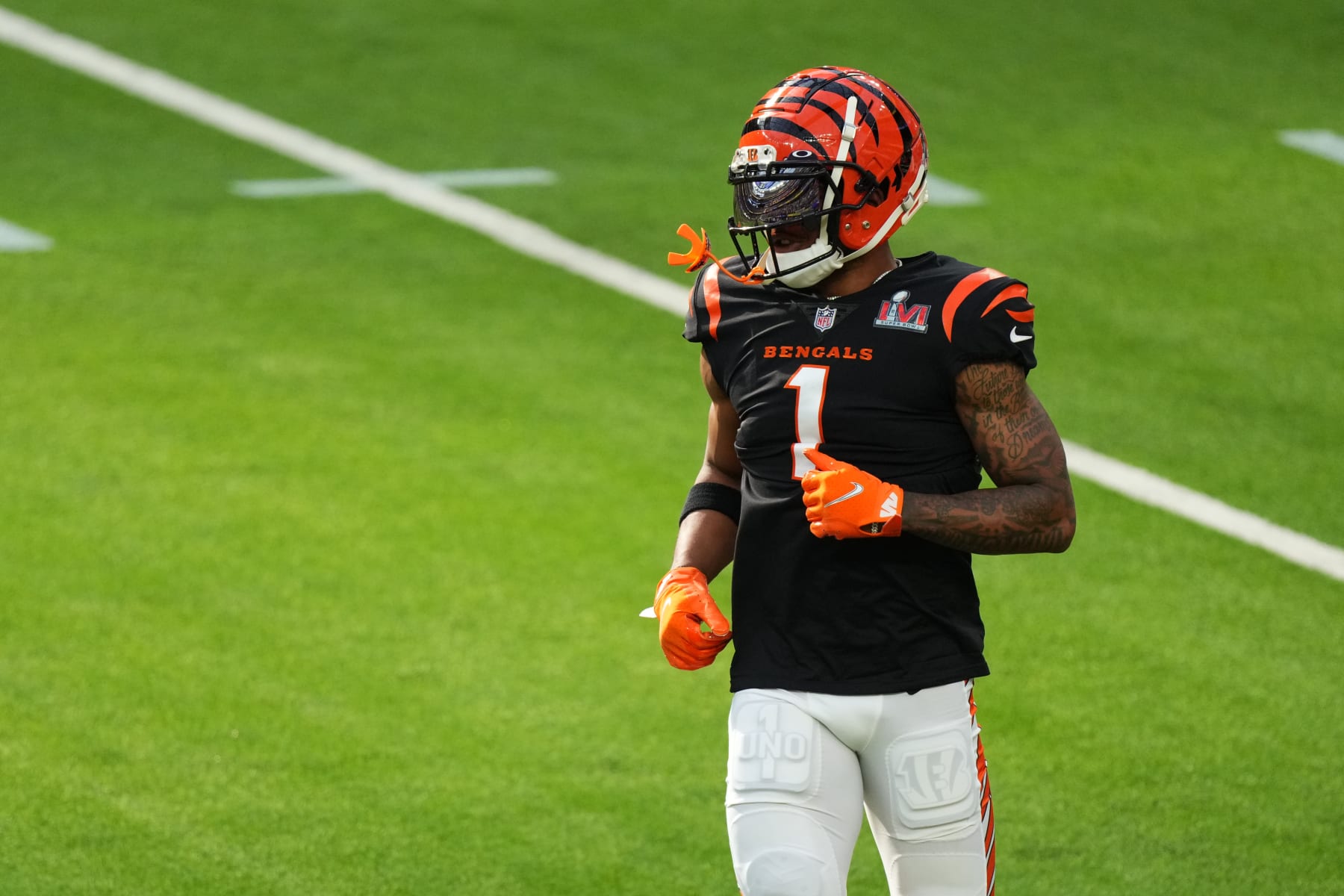 INGLEWOOD, CALIFORNIA - FEBRUARY 13: JaMarr Chase #1 of the Cincinnati Bengals warms up prior to the NFL Super Bowl LVI football game against the Los Angeles Rams at SoFi Stadium on February 13, 2022 in Inglewood, California. (Photo by Cooper Neill/Getty Images)