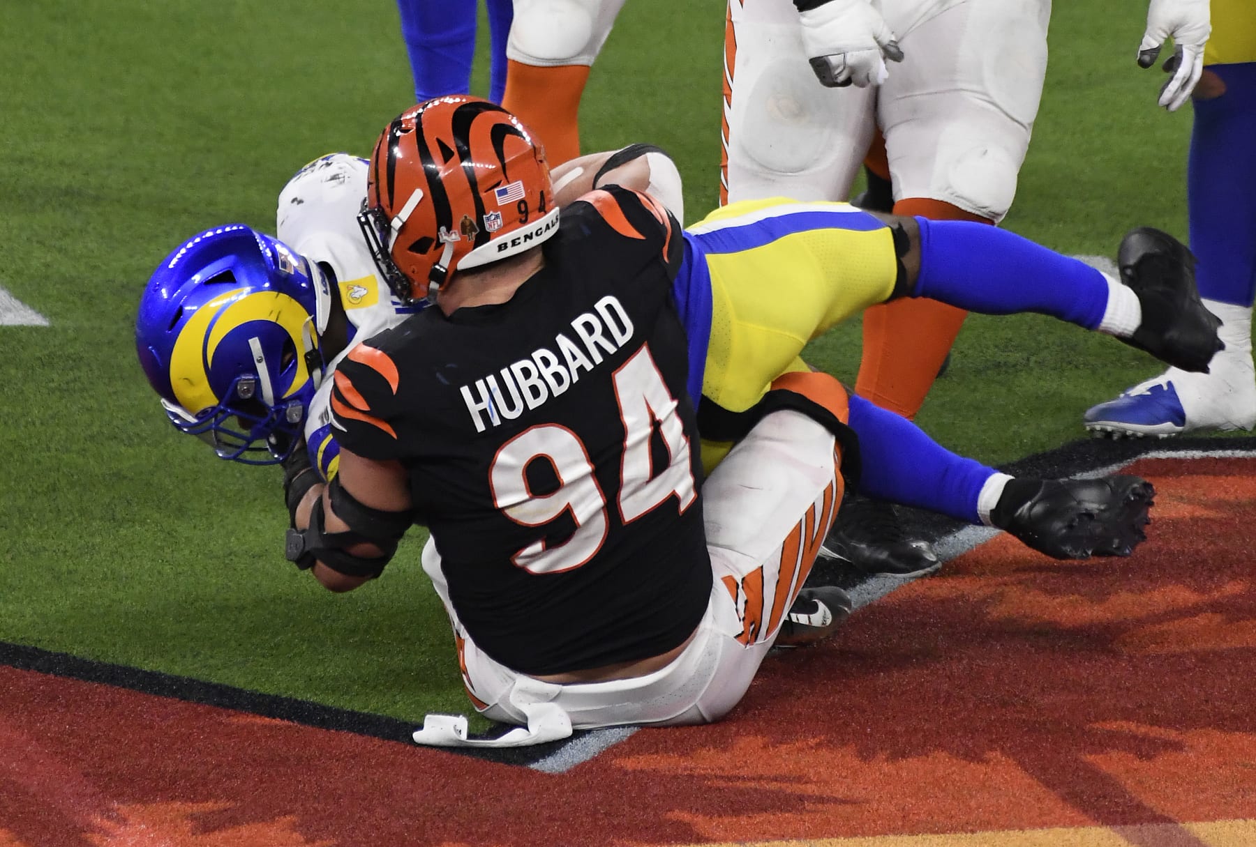 INGLEWOOD, CALIFORNIA - FEBRUARY 13: Sam Hubbard #94 of the Cincinnati Bengals tackles the runner Cam Akers #23 of the ""Los Angeles Rams during Super Bowl LVI at SoFi Stadium on February 13, 2022 in Inglewood, California. (Photo by Focus on Sport/Getty Images)