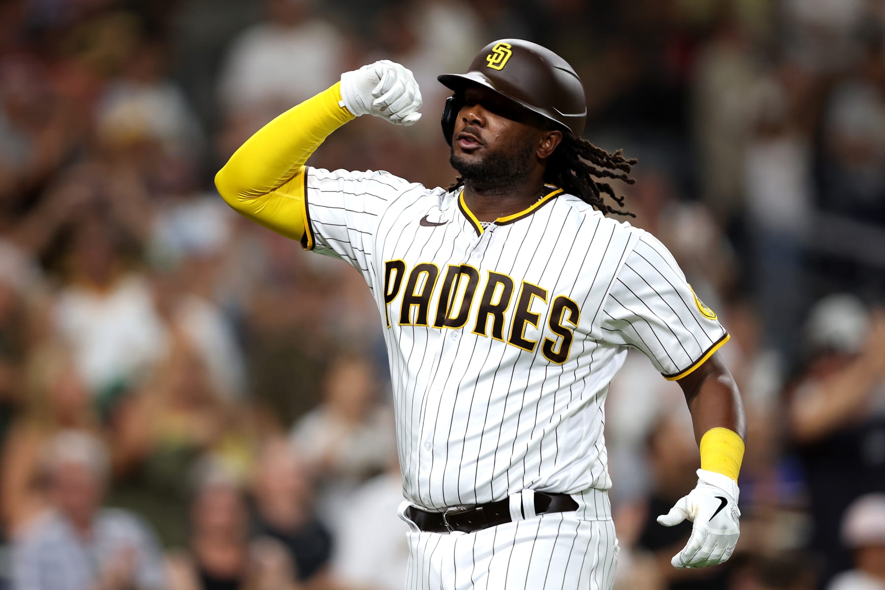 SAN DIEGO, CALIFORNIA - SEPTEMBER 06: Josh Bell #24 of the San Diego Padres reacts after hitting a solo homerum during the seventh inning of a game against the Arizona Diamondbacks at PETCO Park on September 06, 2022 in San Diego, California. (Photo by Sean M. Haffey/Getty Images)