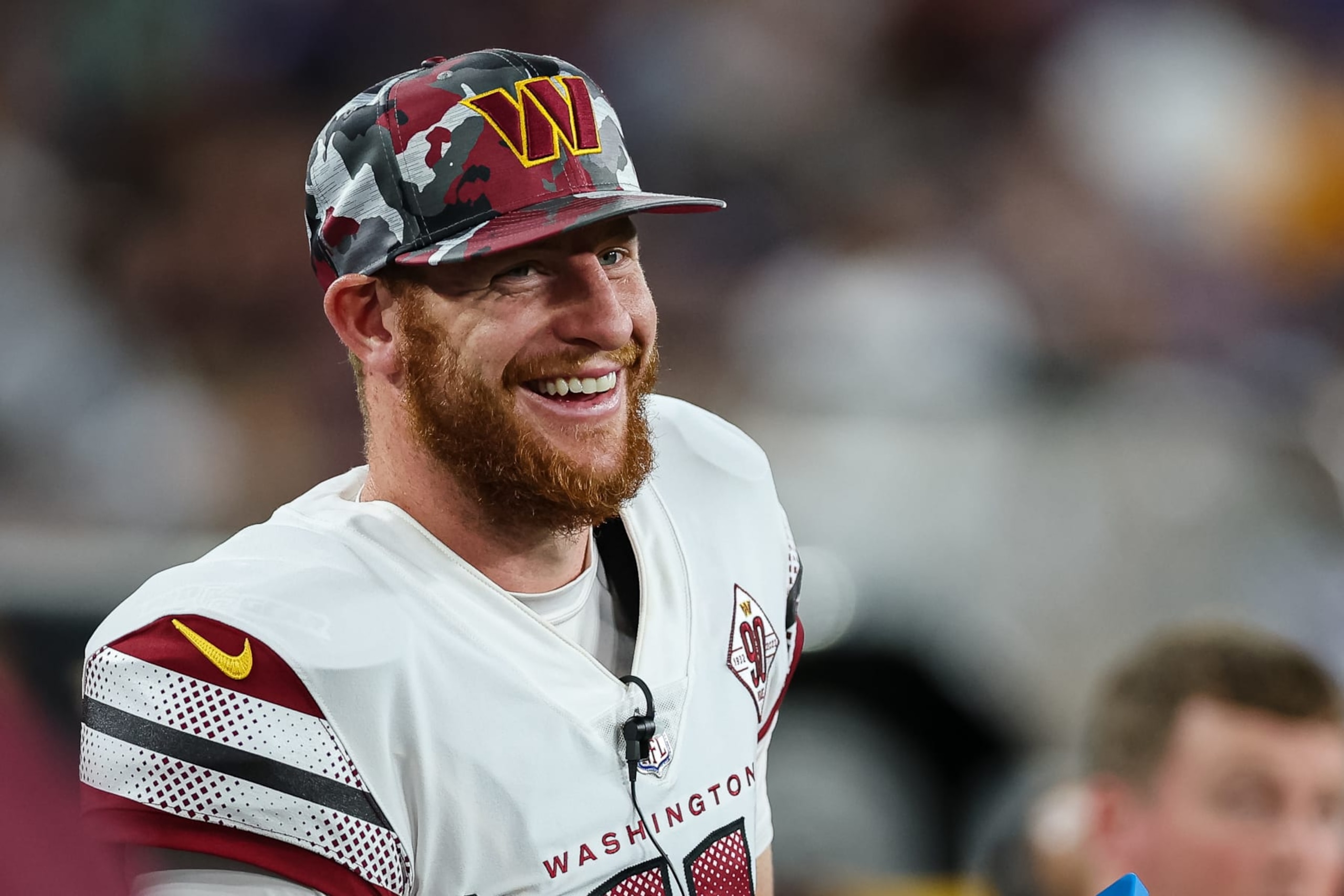 BALTIMORE, MD - AUGUST 27: Carson Wentz #11 of the Washington Commanders reacts on the sidelines against the Baltimore Ravens during the first half of a preseason game at M&T Bank Stadium on August 27, 2022 in Baltimore, Maryland. (Photo by Scott Taetsch/Getty Images)