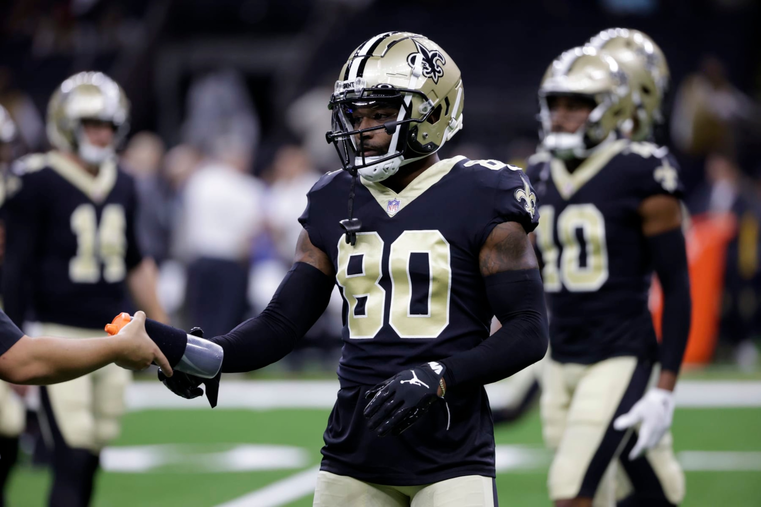 New Orleans Saints wide receiver Jarvis Landry (80) takes water before an NFL preseason football game against the Los Angeles Chargers in New Orleans, Friday, Aug. 26, 2022. (AP Photo/Derick Hingle)