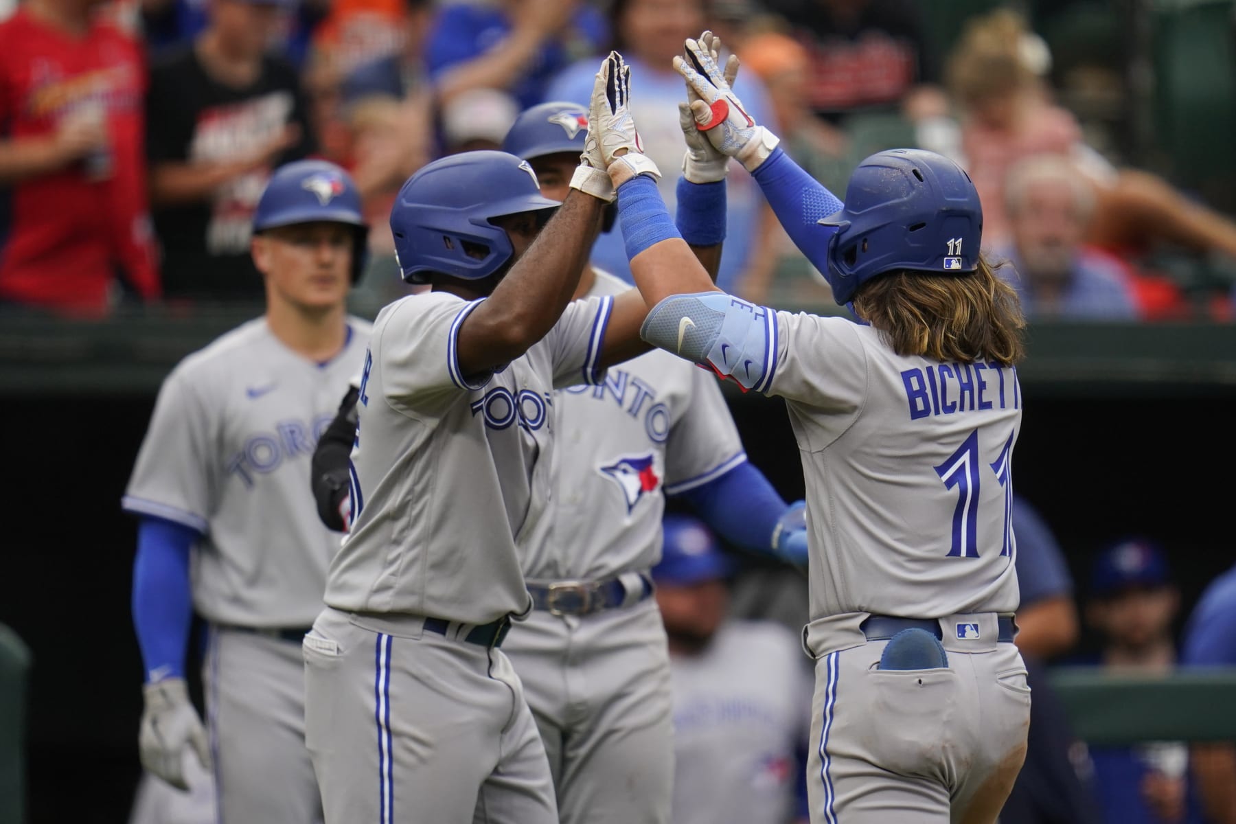 Toronto Blue Jays' Bo Bichette, right, celebrates with Jackie Bradley Jr., left, after Bichette hit a three-run home run off Baltimore Orioles relief pitcher Nick Vespi during the third inning of the second game of a baseball doubleheader, Monday, Sept. 5, 2022, in Baltimore. Bradley Jr. and teammate George Springer scored on the home run. (AP Photo/Julio Cortez) Toronto Blue Jays' Bo Bichette, right, celebrates with Jackie Bradley Jr., left, after Bichette hit a three-run home run off Baltimore Orioles relief pitcher Nick Vespi during the third inning of the second game of a baseball doubleheader, Monday, Sept. 5, 2022, in Baltimore. Bradley Jr. and teammate George Springer scored on the home run. (AP Photo/Julio Cortez)