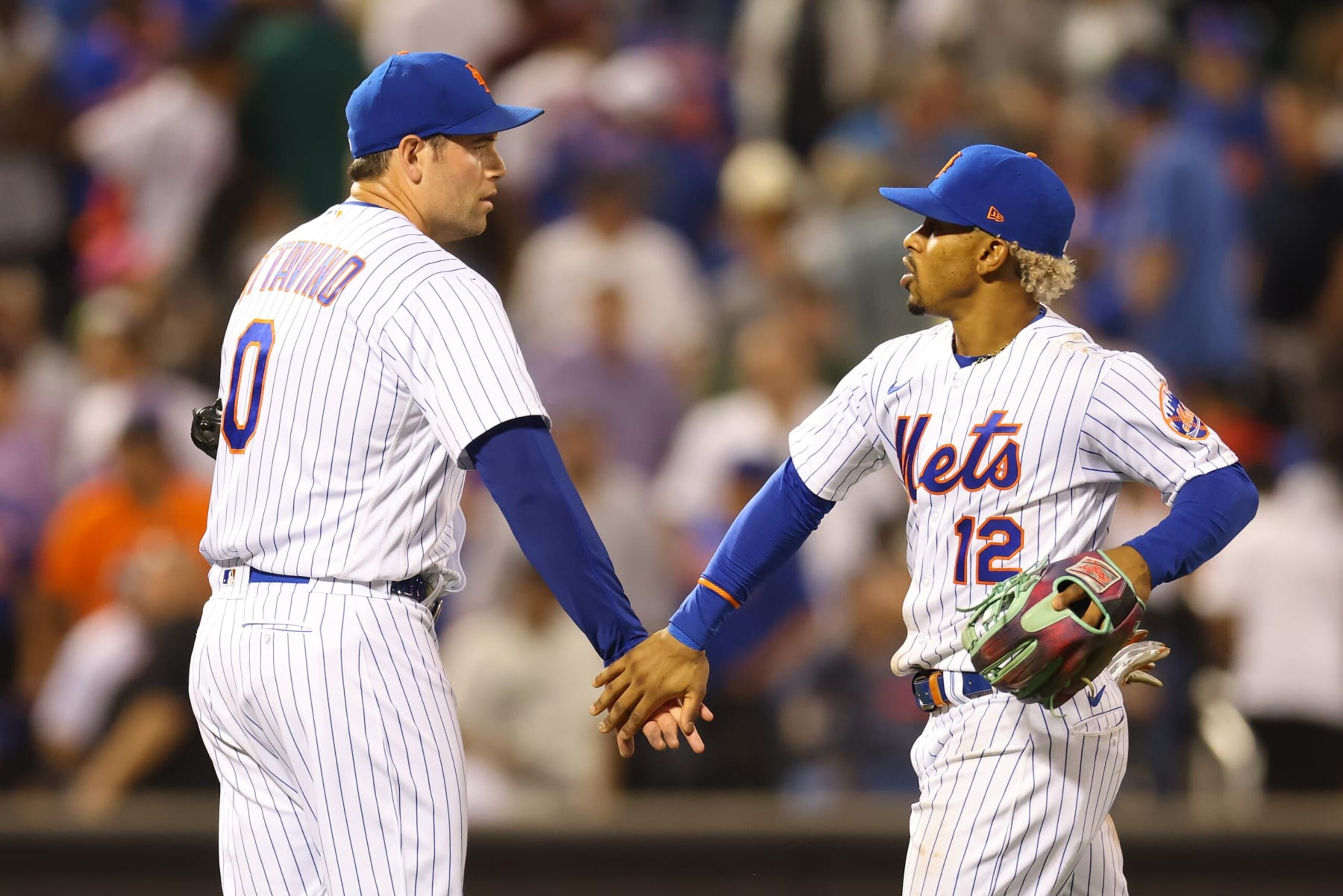 NEW YORK, NEW YORK - AUGUST 25: Francisco Lindor #12 and Adam Ottavino #0 of the New York Mets celebrate after defeating the Colorado Rockies 3-1 at Citi Field on August 25, 2022 in New York City. (Photo by Mike Stobe/Getty Images)