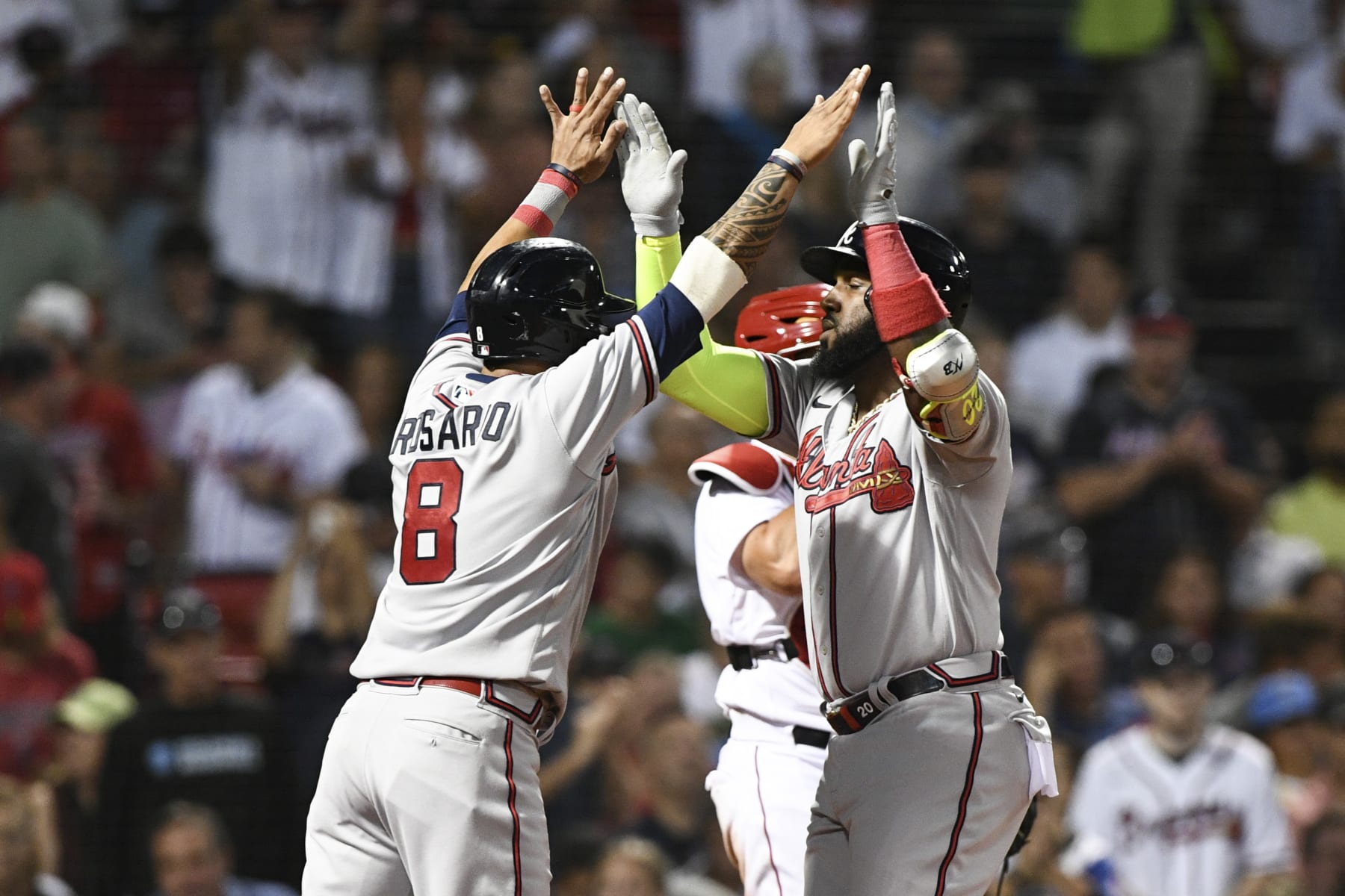BOSTON, MASSACHUSETTS - AUGUST 10: Marcell Ozuna #20 of the Atlanta Braves celebrates with Eddie Rosario #8 after hitting a three-run home run against the Boston Red Sox during the fourth inning at Fenway Park on August 10, 2022 in Boston, Massachusetts. (Photo by Brian Fluharty/Getty Images) BOSTON, MASSACHUSETTS - AUGUST 10: Marcell Ozuna #20 of the Atlanta Braves celebrates with Eddie Rosario #8 after hitting a three-run home run against the Boston Red Sox during the fourth inning at Fenway Park on August 10, 2022 in Boston, Massachusetts. (Photo by Brian Fluharty/Getty Images)