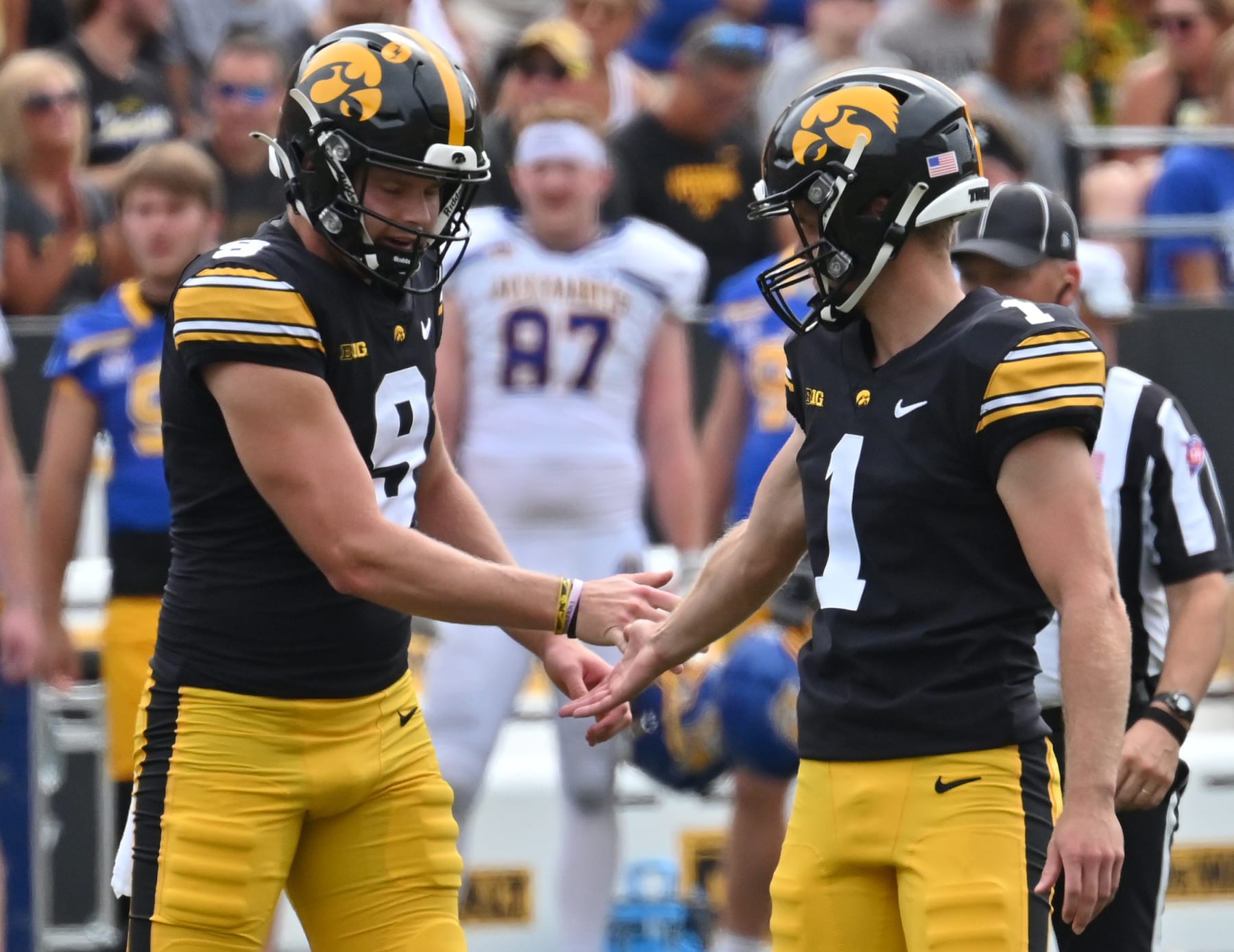 IOWA CITY, IA - SEPTEMBER 03: Iowa punter Tory Taylor (9) congratulate Iowa placekicker Aaron Blom (1) after his successfull field goal during a college football game between the South Dakota State Jackrabbits and the Iowa Hawkeyes, September 03, 2022, at Kinnick Stadium, Iowa City, IA. Photo by Keith Gillett/Icon Sportswire via Getty Images),
