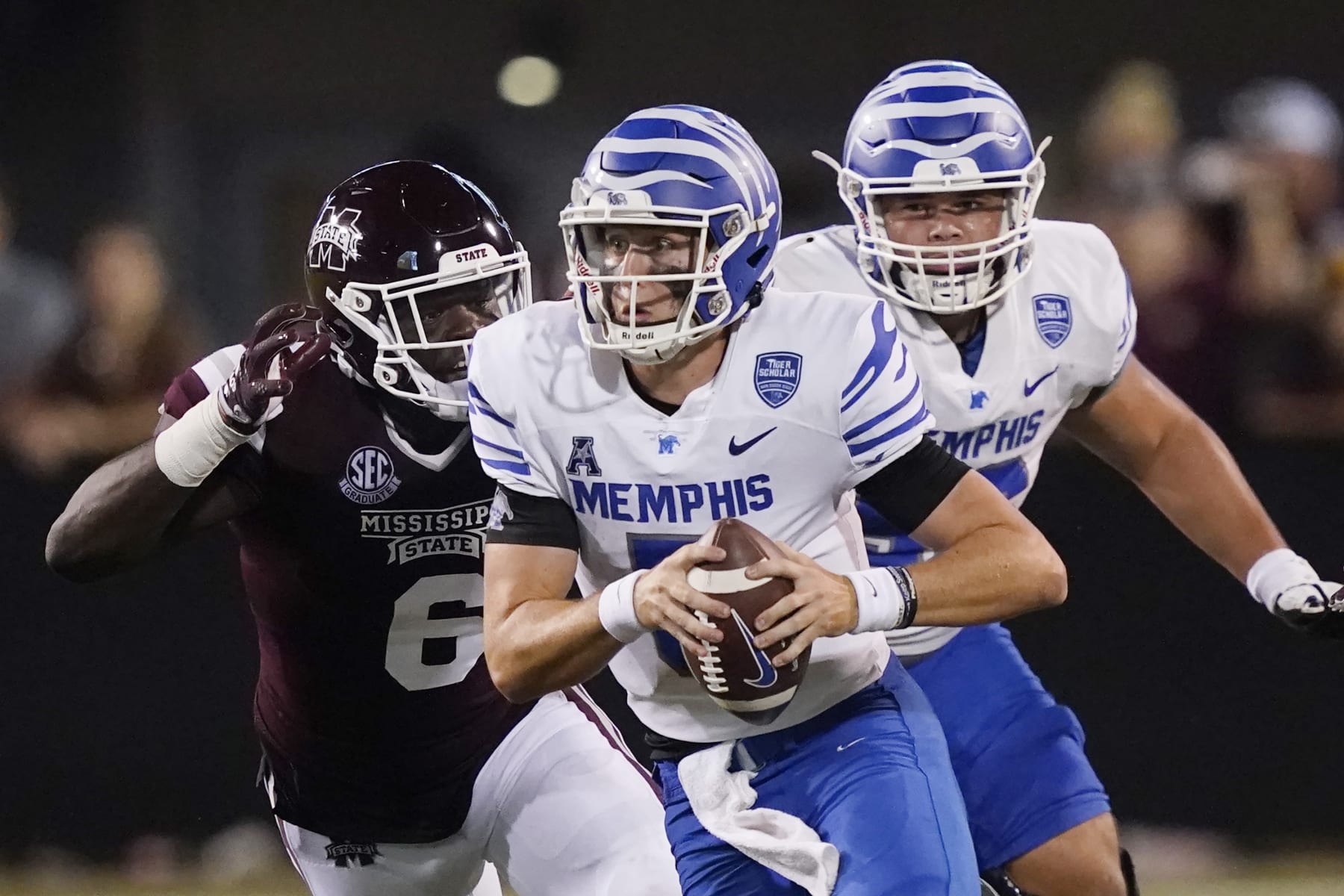 Mississippi State defensive end Jordan Davis (6) pressures Memphis quarterback Seth Henigan (5) during the second half of an NCAA college football game in Starkville, Miss., Saturday, Sept. 3, 2022. Mississippi State won 49-23. (AP Photo/Rogelio V. Solis)