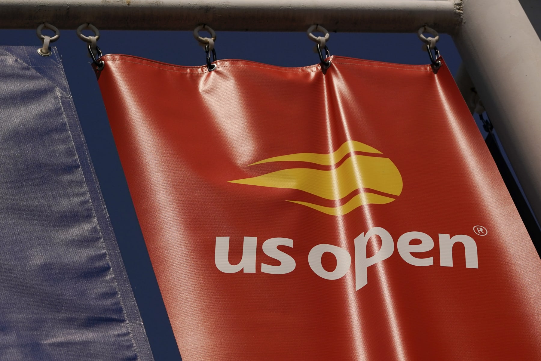 A logo is displayed on the grounds of the U.S. Open tennis tournament in New York, Thursday, Aug. 25, 2022. (AP Photo/Seth Wenig)
