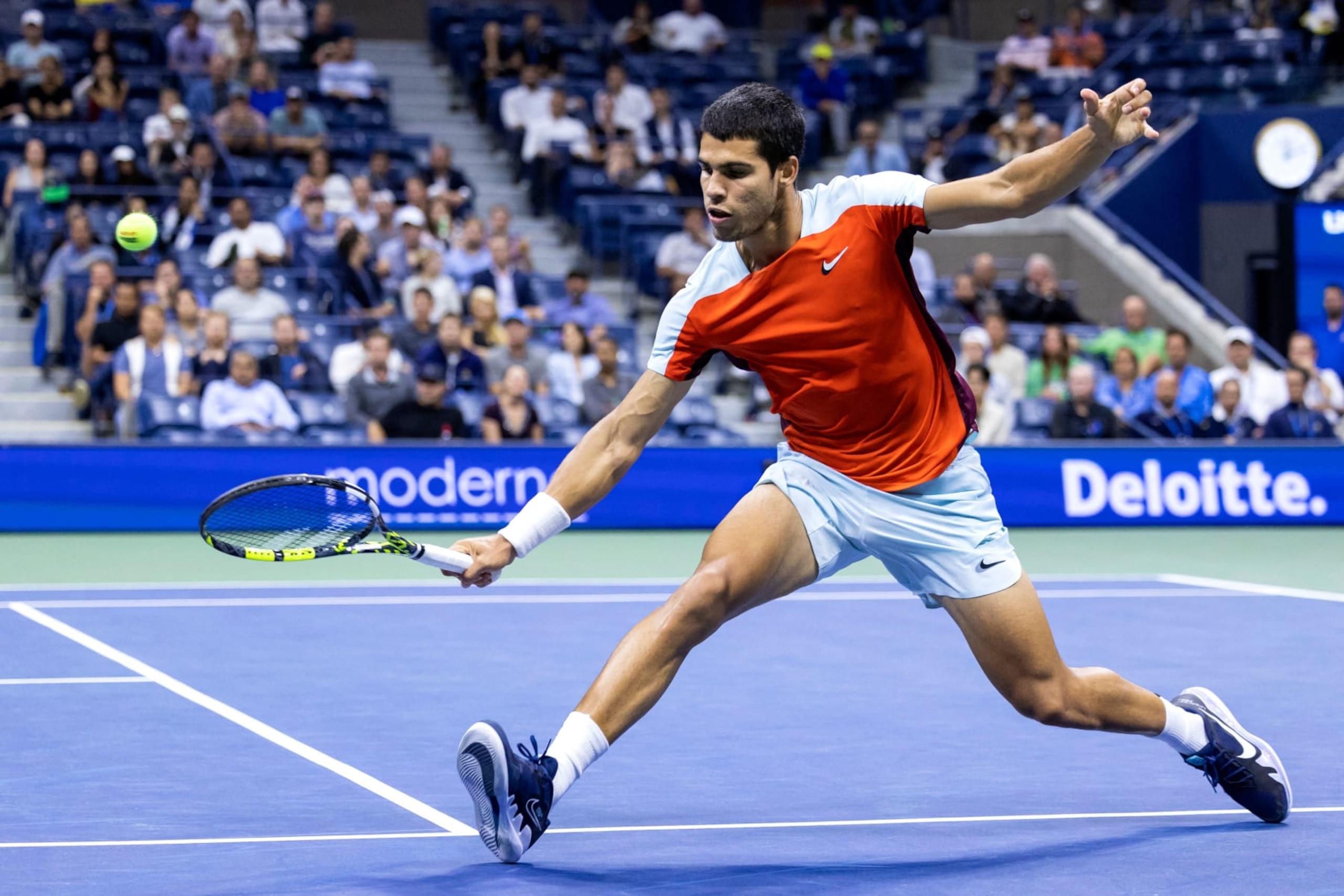 Spain's Carlos Alcaraz hits a return to Italy's Jannik Sinner during their 2022 US Open Tennis tournament men's singles quarter-final match at the USTA Billie Jean King National Tennis Center in New York, on September 7, 2022. (Photo by Corey Sipkin / AFP) (Photo by COREY SIPKIN/AFP via Getty Images)