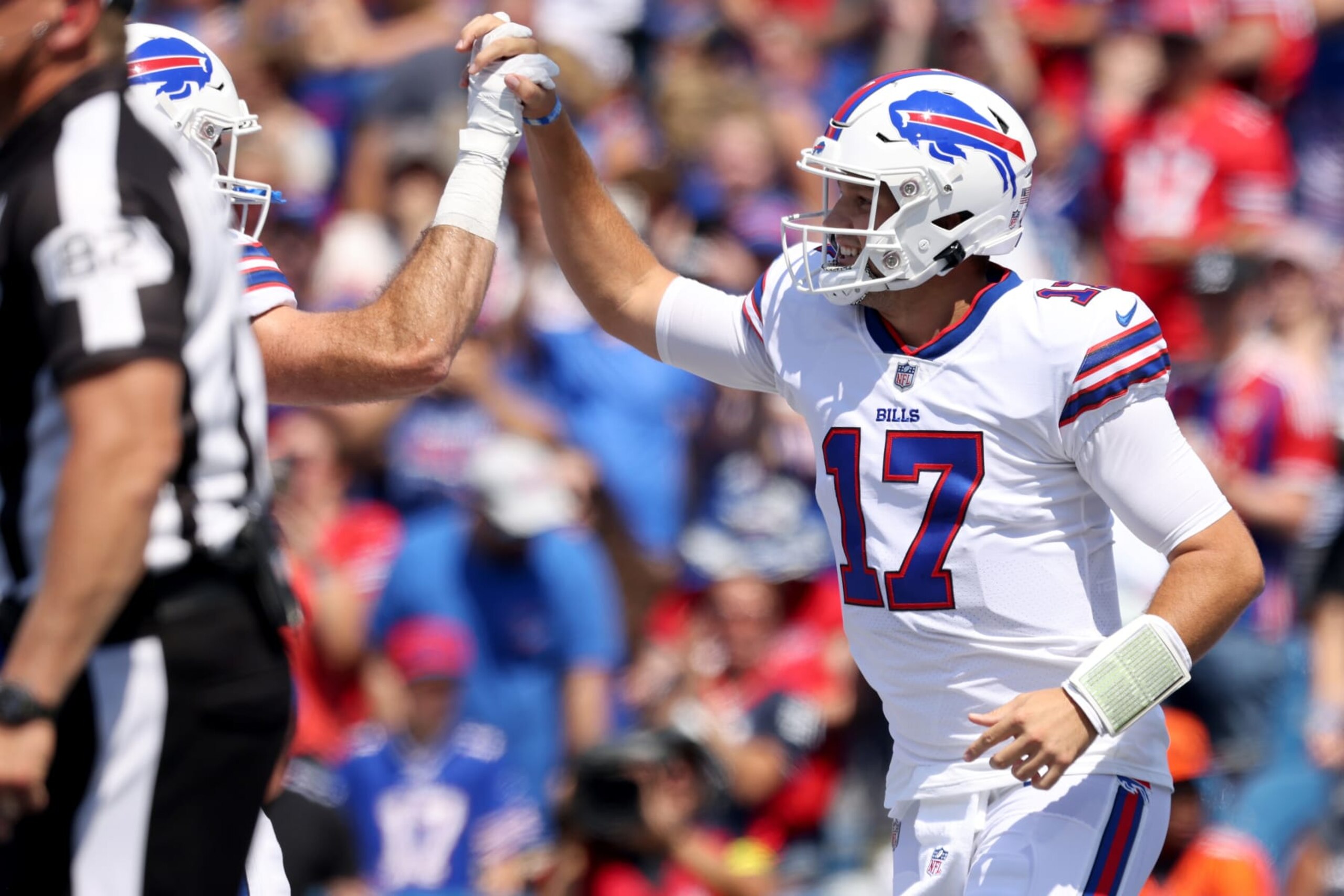 ORCHARD PARK, NEW YORK - AUGUST 20: Josh Allen #17 of the Buffalo Bills celebrates throwing a pass for a touchdown during the first quarter against the Denver Broncos at Highmark Stadium on August 20, 2022 in Orchard Park, New York. (Photo by Bryan M. Bennett/Getty Images)