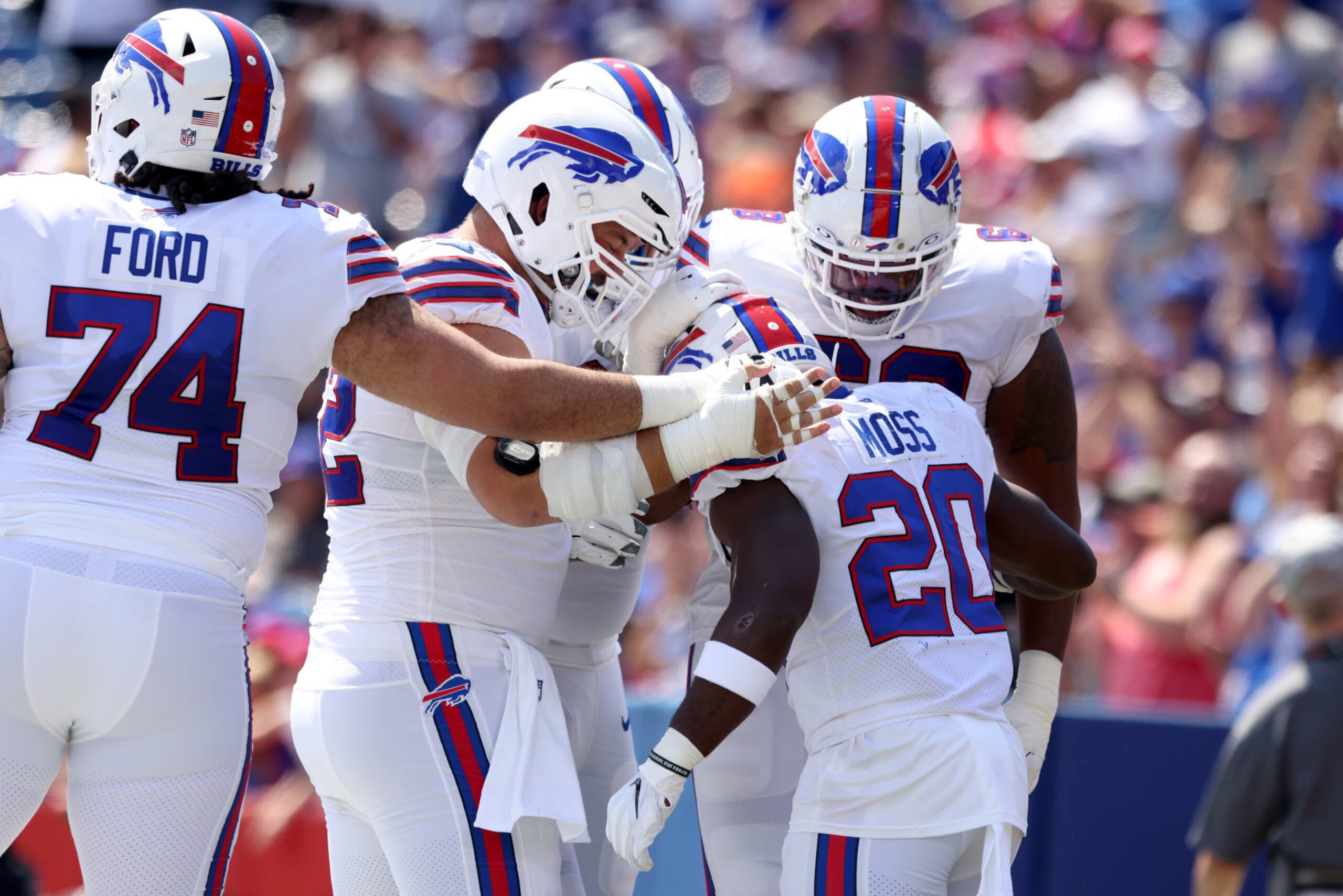 ORCHARD PARK, NEW YORK - AUGUST 20: Buffalo Bills celebrate after Zack Moss #20 scored a touchdown during the second quarter of a preseason game against the Denver Broncos at Highmark Stadium on August 20, 2022 in Orchard Park, New York. (Photo by Bryan M. Bennett/Getty Images)