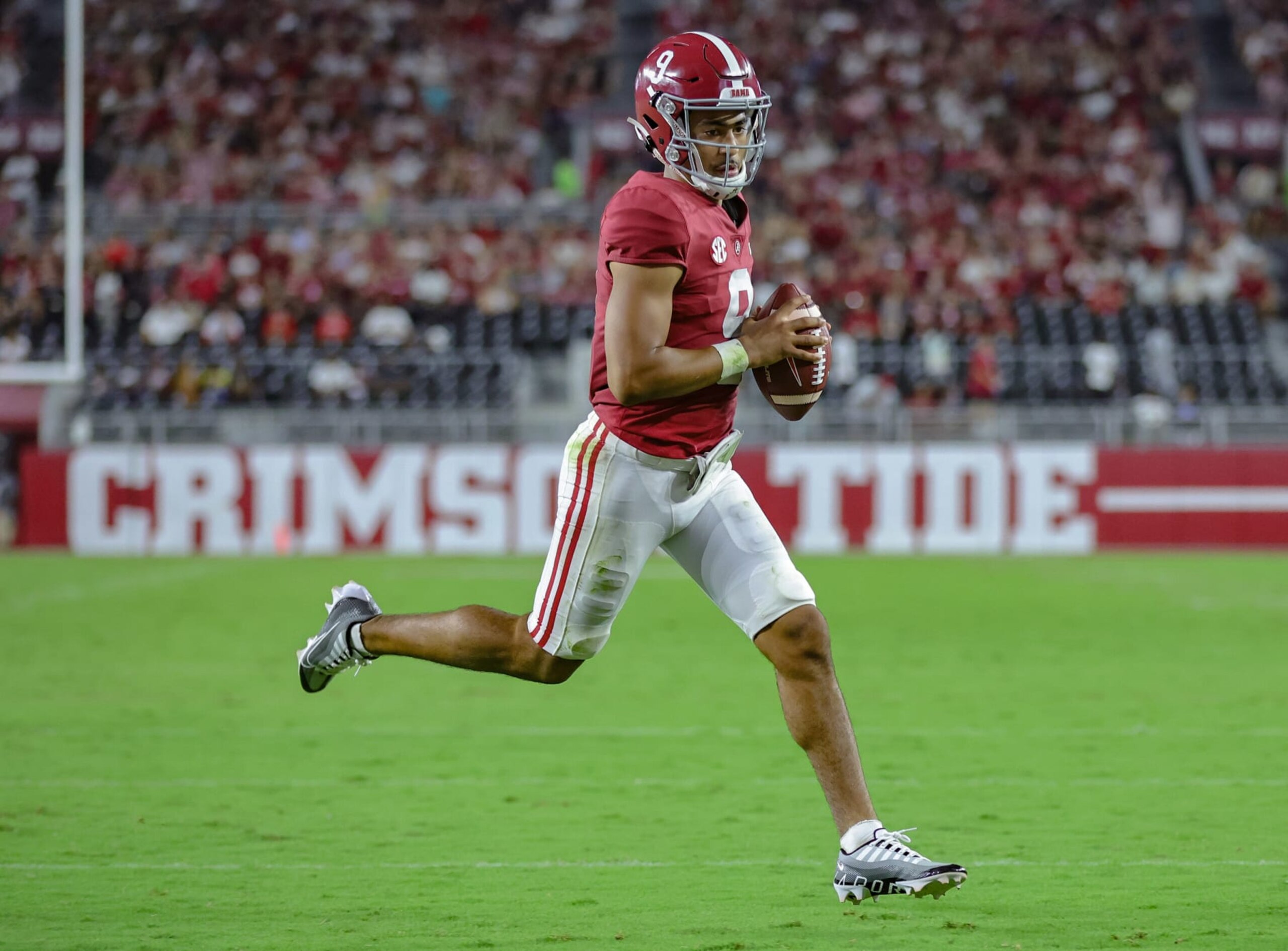 TUSCALOOSA, ALABAMA - SEPTEMBER 3: Bryce Young #9 of the Alabama Crimson Tide runs for a touchdown against the Utah State Aggies at Bryant Denny Stadium on September 3, 2022 in Tuscaloosa, Alabama. (Photo by Brandon Sumrall/Getty Images)