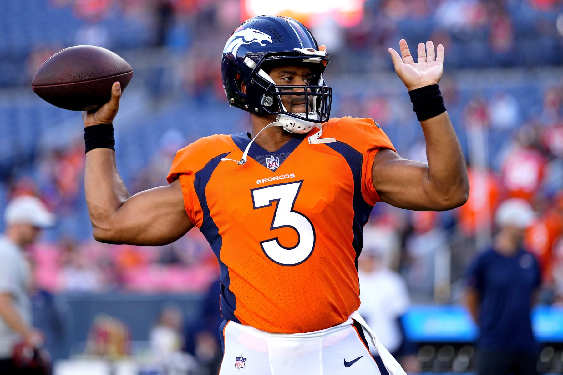 Denver Broncos quarterback Russell Wilson (3) warms up prior to an NFL preseason football game against the Minnesota Vikings, Saturday, Aug. 27, 2022, in Denver. (AP Photo/Jack Dempsey)