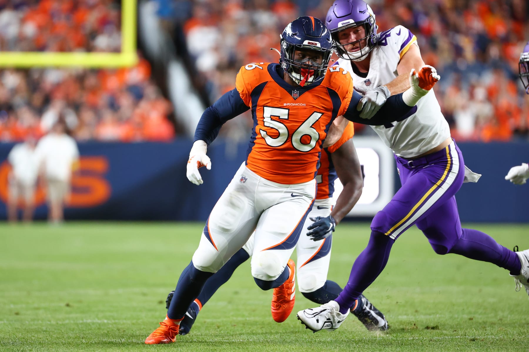 DENVER, CO - AUGUST 27: Baron Browning #56 of the Denver Broncos rushes through the Minnesota Vikings offensive line during the first half of a preseason game at Empower Field At Mile High on August 27, 2022 in Denver, Colorado. (Photo by Justin Tafoya/Getty Images)