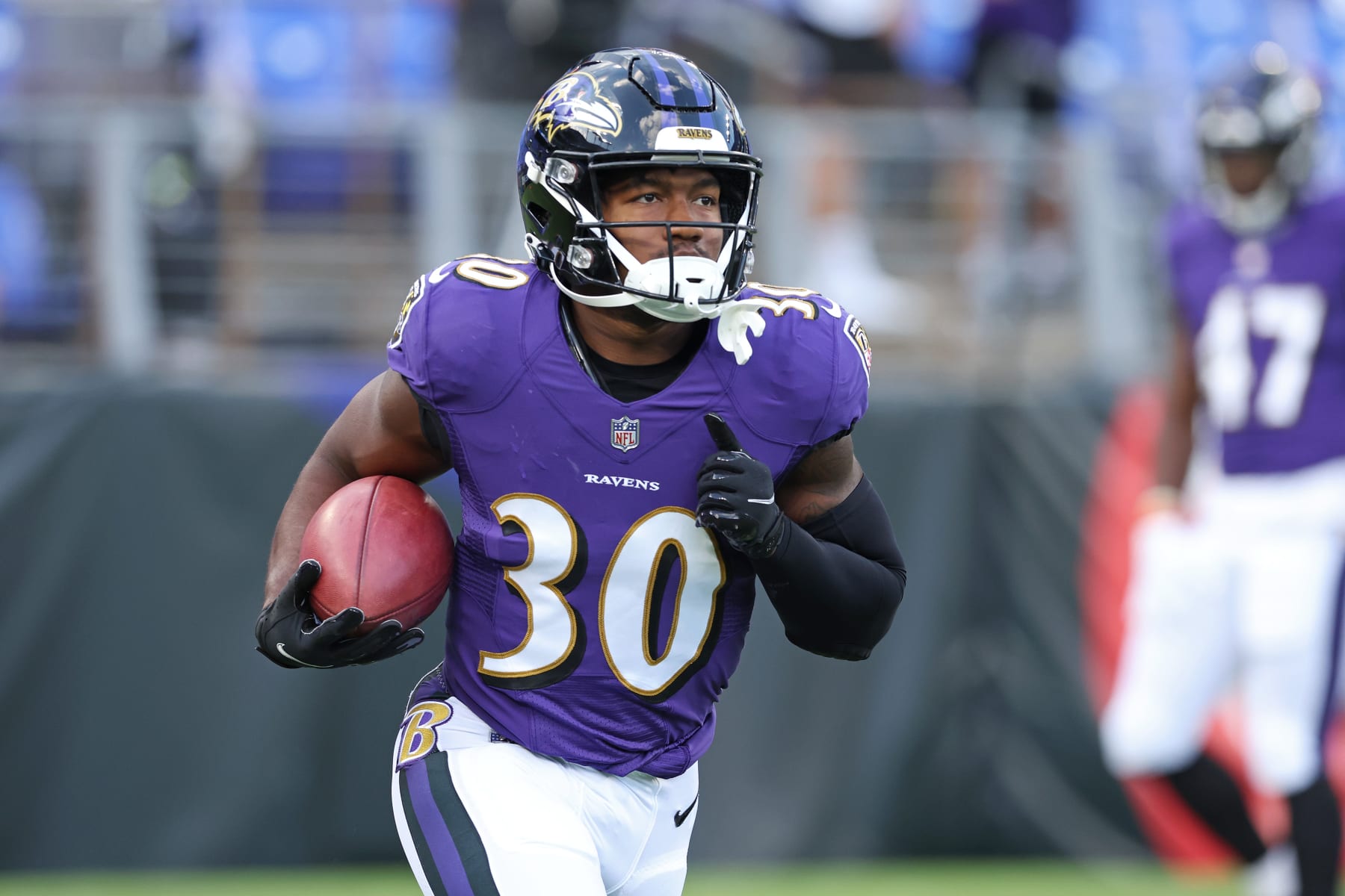 BALTIMORE, MARYLAND - AUGUST 27: Running Back Tyler Badie #30 of the Baltimore Ravens warms up prior to the preseason game against the Washington Commanders at M&T Bank Stadium on August 27, 2022 in Baltimore, Maryland. (Photo by Todd Olszewski/Getty Images)