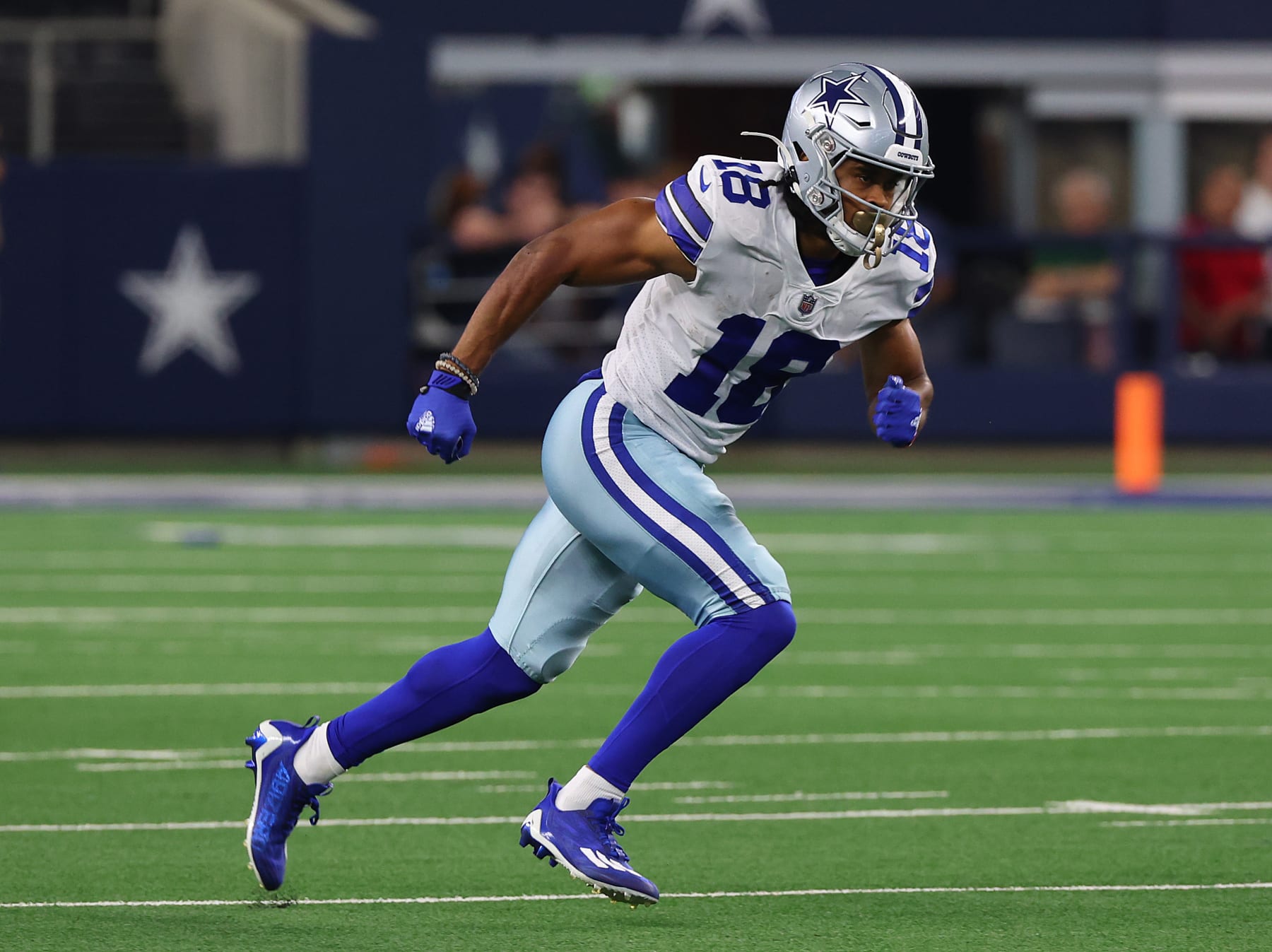 ARLINGTON, TEXAS - AUGUST 26: Jalen Tolbert #18 of the Dallas Cowboys breaks away after the snap against the Seattle Seahawks in an NFL preseason football game at AT&T Stadium on August 26, 2022 in Arlington, Texas. (Photo by Richard Rodriguez/Getty Images)