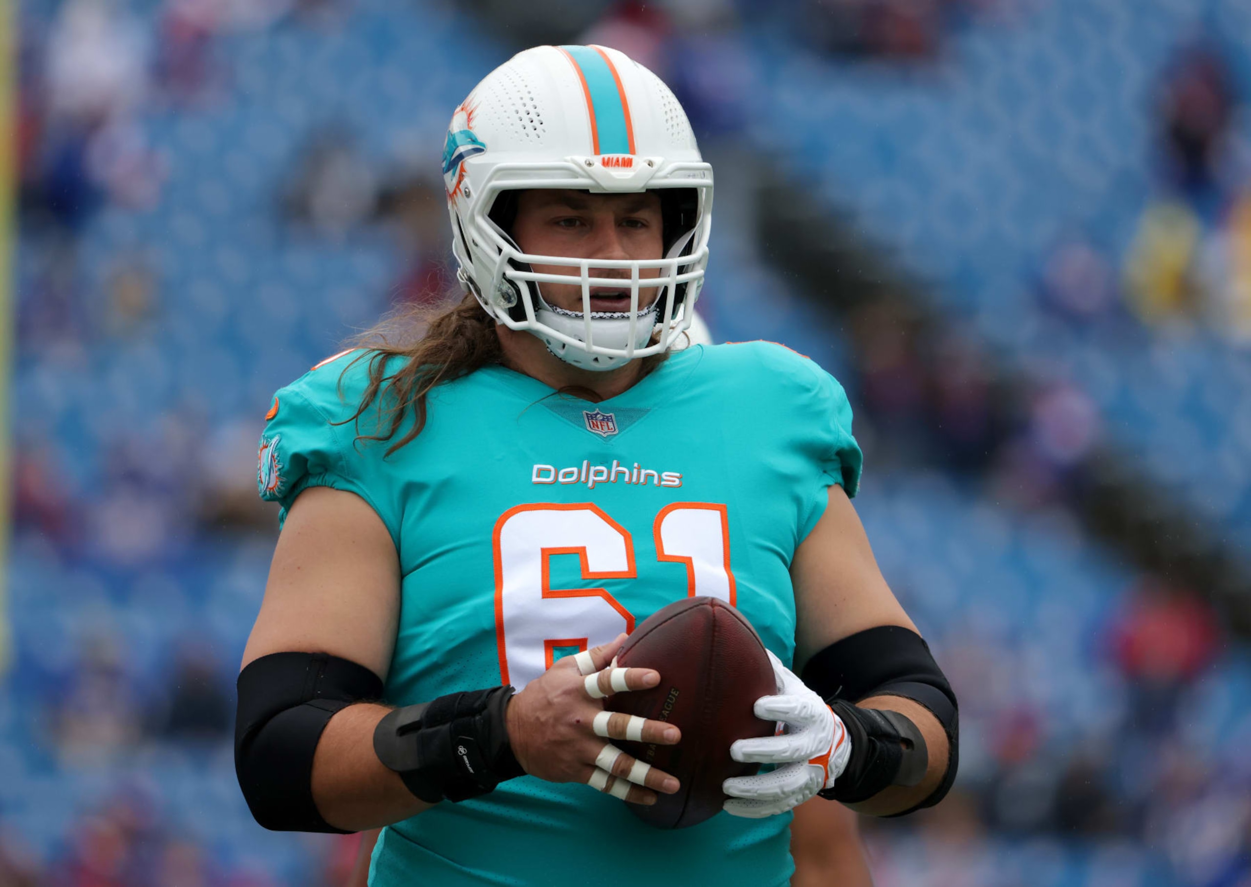 ORCHARD PARK, NY - OCTOBER 31: Austin Reiter #61 of the Miami Dolphins on the field before a game against the Buffalo Bills at Highmark Stadium on October 31, 2021 in Orchard Park, New York. (Photo by Timothy T Ludwig/Getty Images)