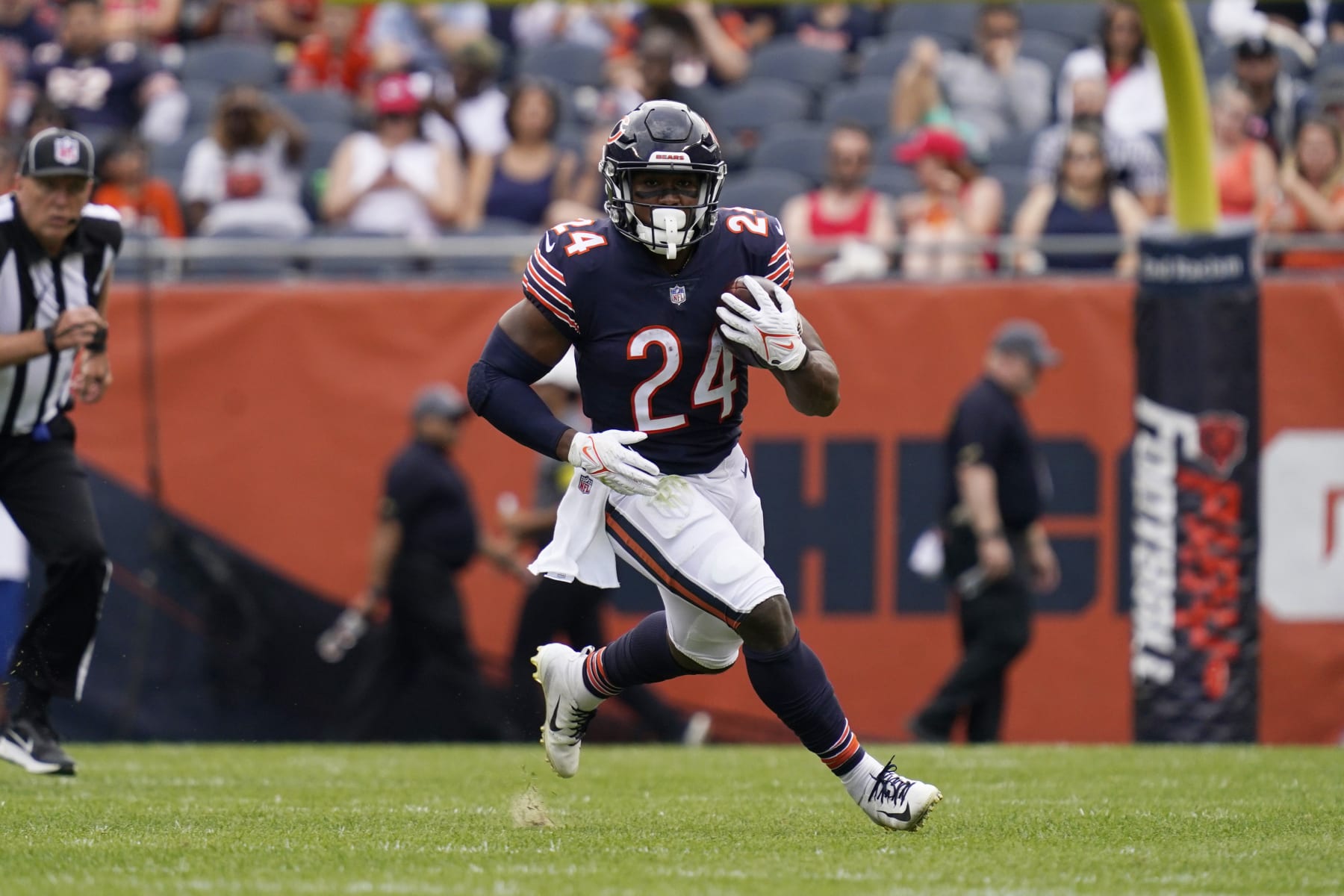Chicago Bears running back Khalil Herbert runs with the ball against the Kansas City Chiefs during the first half of a preseason NFL football game Saturday, Aug. 13, 2022, in Chicago.(AP Photo/Nam Y. Huh)