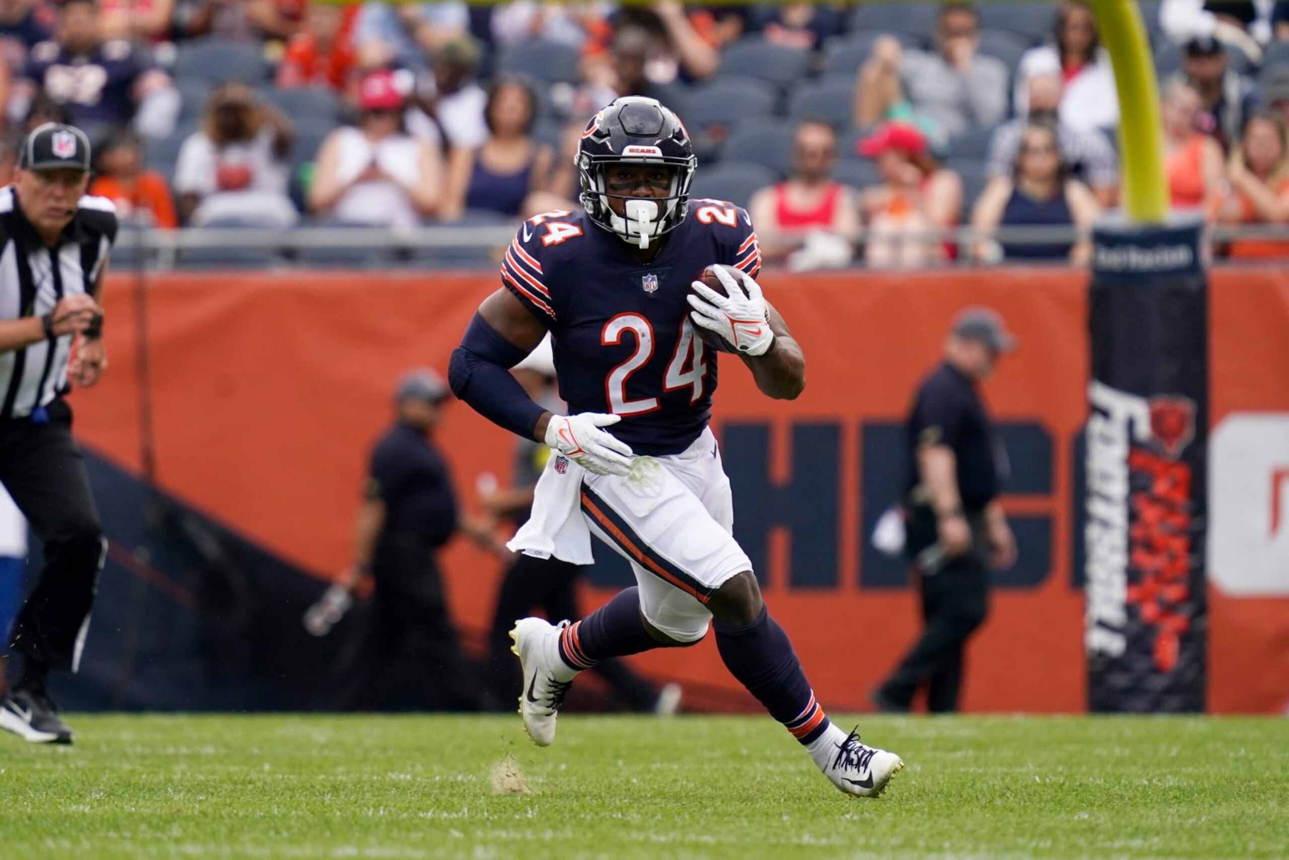 Chicago Bears running back Khalil Herbert runs with the ball against the Kansas City Chiefs during the first half of a preseason NFL football game Saturday, Aug. 13, 2022, in Chicago.(AP Photo/Nam Y. Huh)