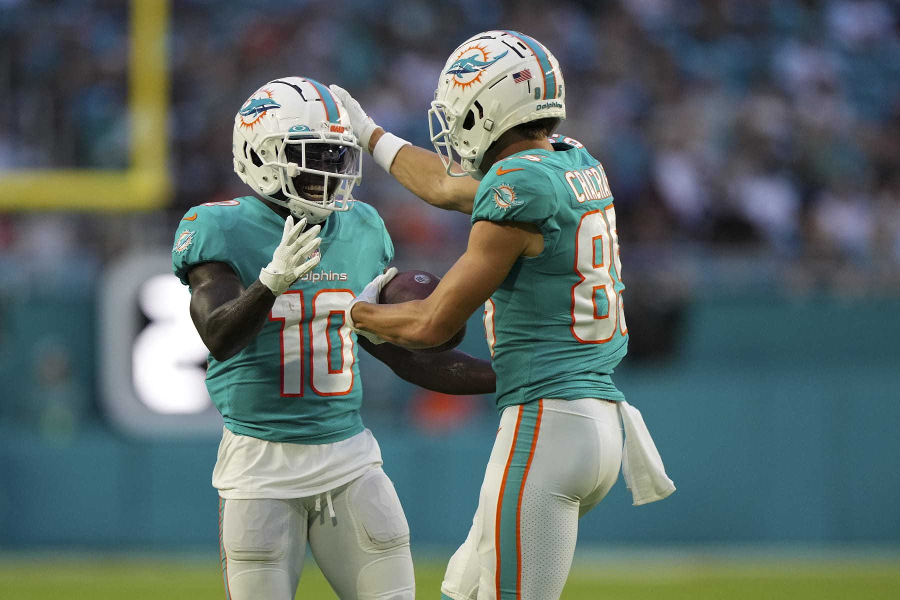 MIAMI GARDENS, FLORIDA - AUGUST 27: River Cracraft #85 of the Miami Dolphins celebrates with Tyreek Hill #10 after scoring a touchdown in the first quarter of the preseason game against the Philadelphia Eagles at Hard Rock Stadium on August 27, 2022 in Miami Gardens, Florida. (Photo by Eric Espada/Getty Images)