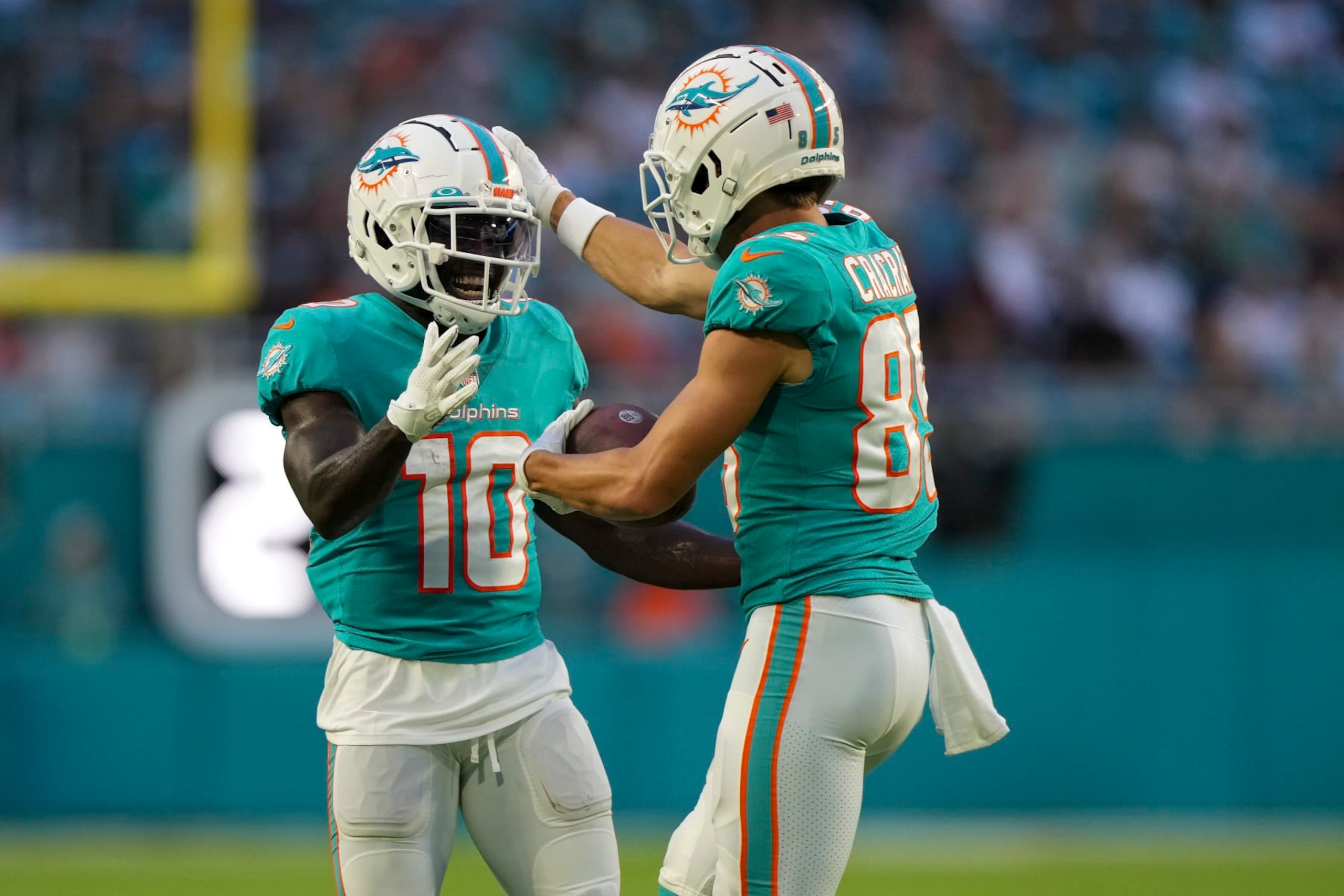 MIAMI GARDENS, FLORIDA - AUGUST 27: River Cracraft #85 of the Miami Dolphins celebrates with Tyreek Hill #10 after scoring a touchdown in the first quarter of the preseason game against the Philadelphia Eagles at Hard Rock Stadium on August 27, 2022 in Miami Gardens, Florida. (Photo by Eric Espada/Getty Images)