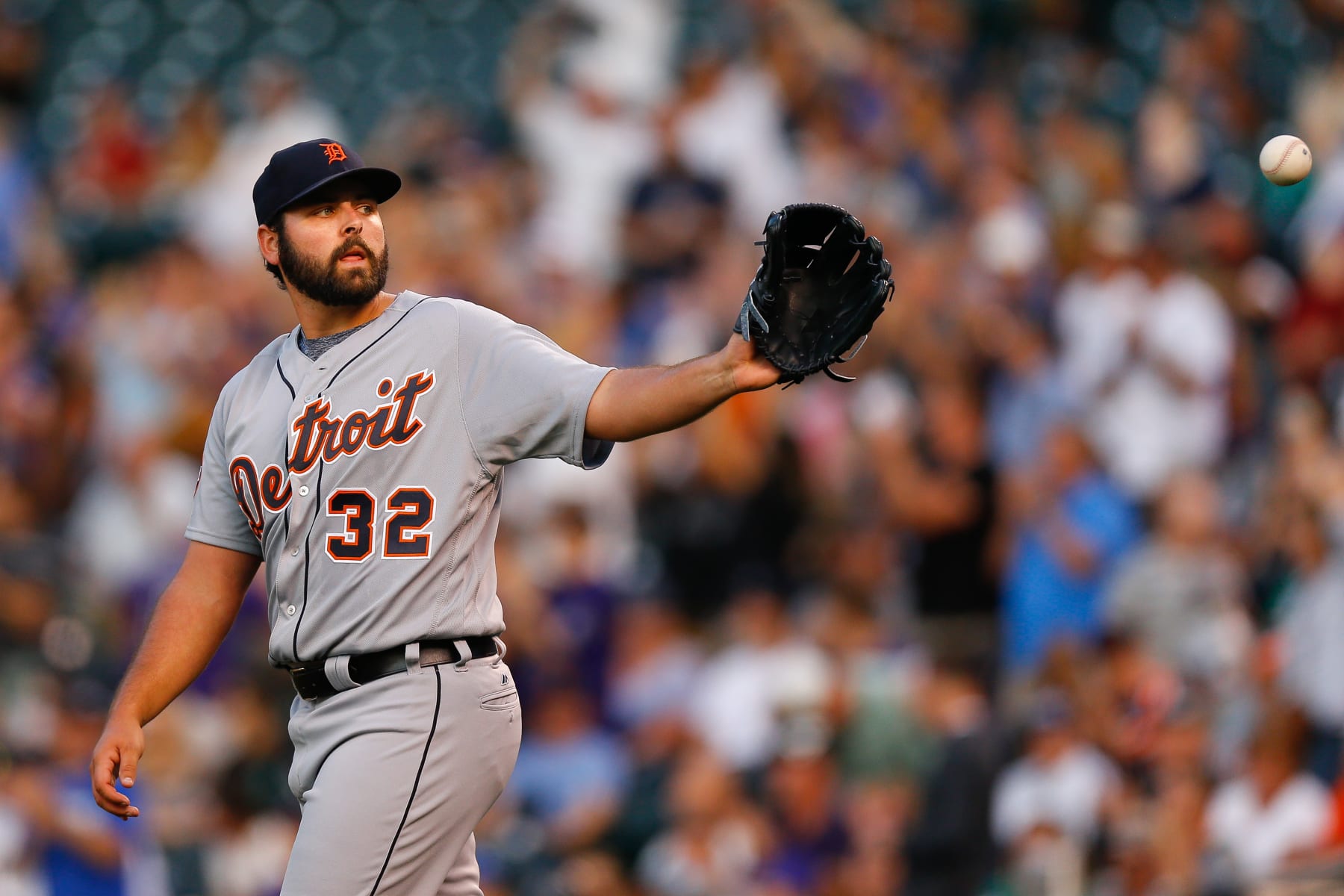 DENVER, CO - AUGUST 29:  Starting pitcher Michael Fulmer #32 of the Detroit Tigers catches a new ball after giving up a solo home run to DJ LeMahieu of the Colorado Rockies during the first inning of an interleague game at Coors Field on August 29, 2017 in Denver, Colorado. (Photo by Justin Edmonds/Getty Images)