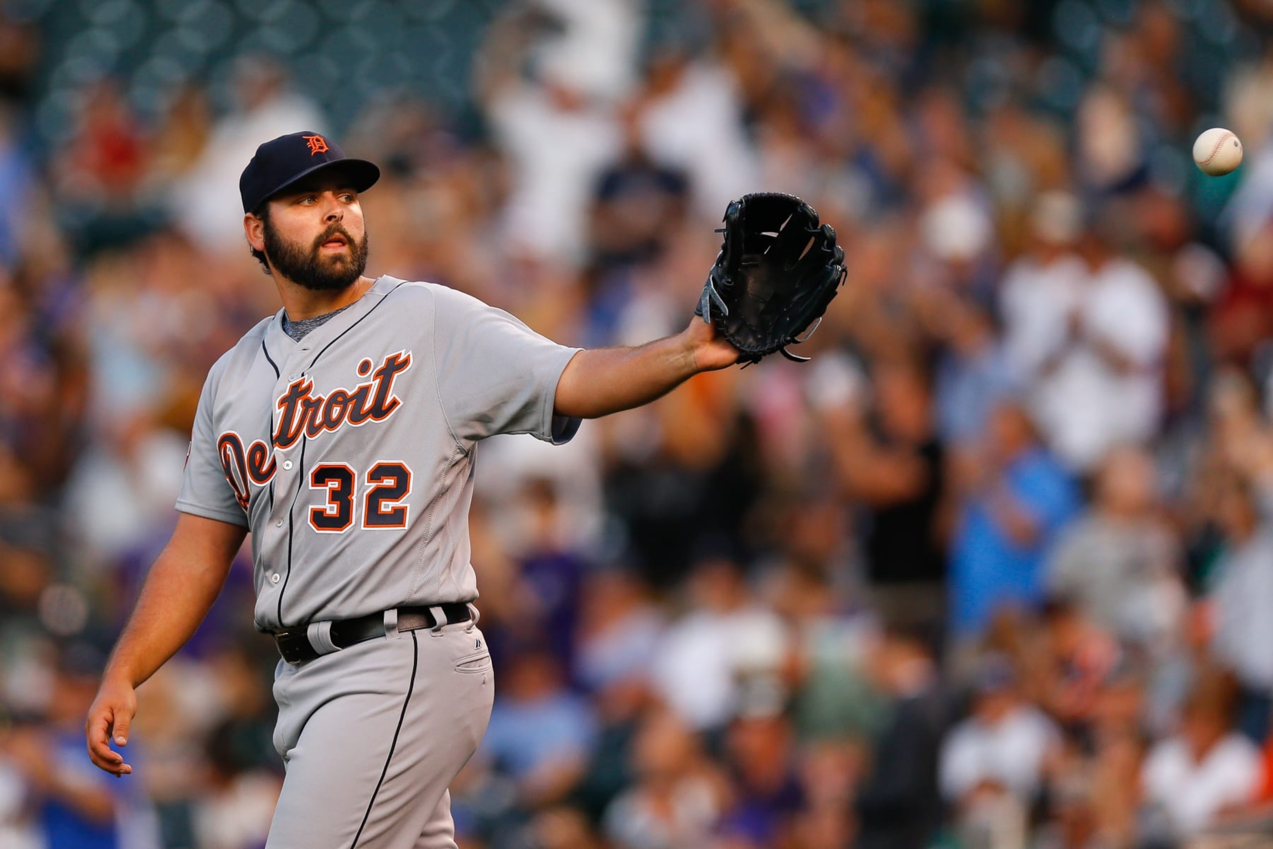 DENVER, CO - AUGUST 29:  Starting pitcher Michael Fulmer #32 of the Detroit Tigers catches a new ball after giving up a solo home run to DJ LeMahieu of the Colorado Rockies during the first inning of an interleague game at Coors Field on August 29, 2017 in Denver, Colorado. (Photo by Justin Edmonds/Getty Images)