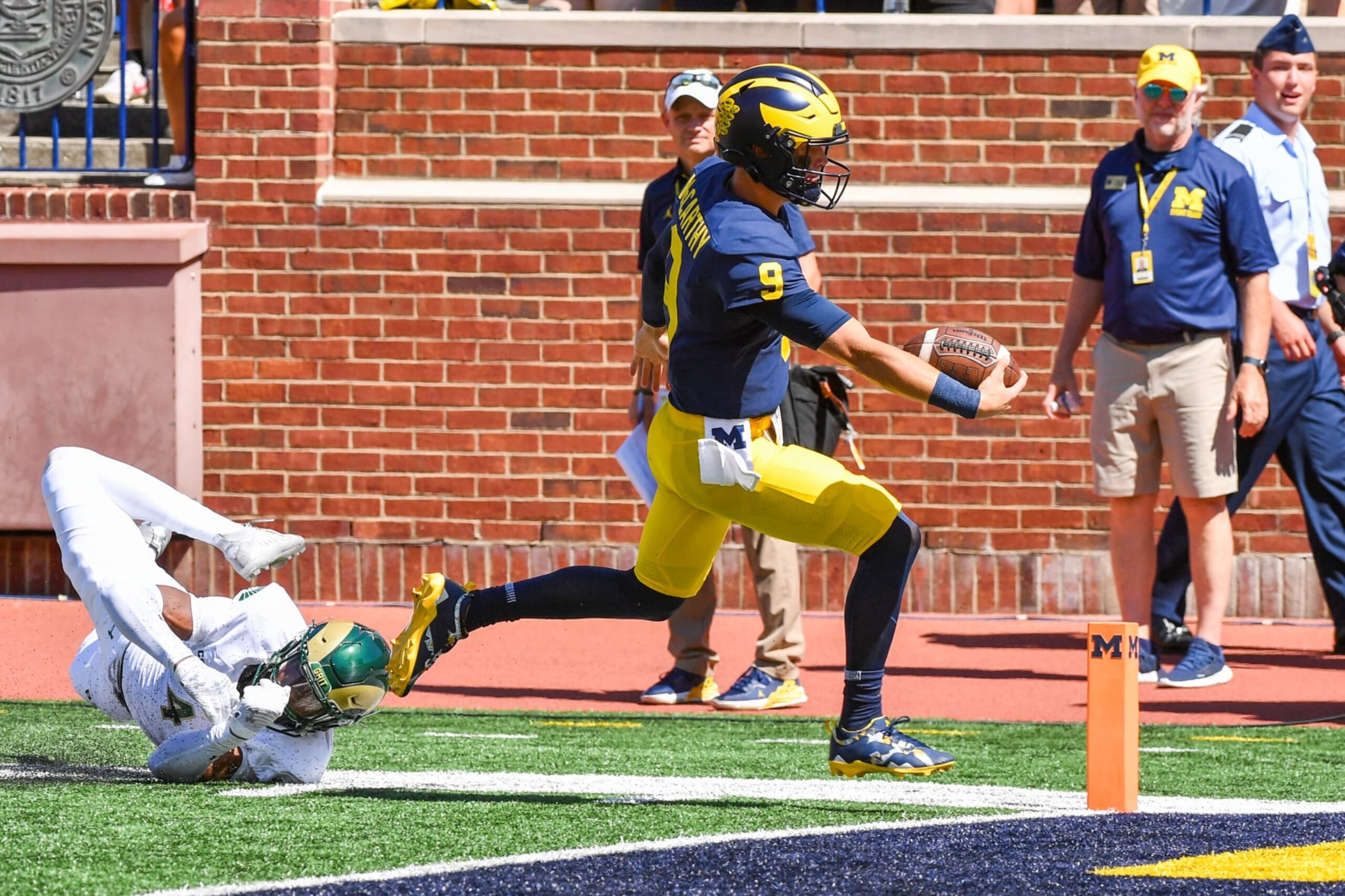 ANN ARBOR, MICHIGAN - SEPTEMBER 03: J.J. McCarthy #9 of the Michigan Wolverines scores a TD during the second half of a college football game against the Colorado State Rams at Michigan Stadium on September 03, 2022 in Ann Arbor, Michigan. The Michigan Wolverines won the game 51-7 over the Colorado State Rams. (Photo by Aaron J. Thornton/Getty Images) ANN ARBOR, MICHIGAN - SEPTEMBER 03: J.J. McCarthy #9 of the Michigan Wolverines scores a TD during the second half of a college football game against the Colorado State Rams at Michigan Stadium on September 03, 2022 in Ann Arbor, Michigan. The Michigan Wolverines won the game 51-7 over the Colorado State Rams. (Photo by Aaron J. Thornton/Getty Images)