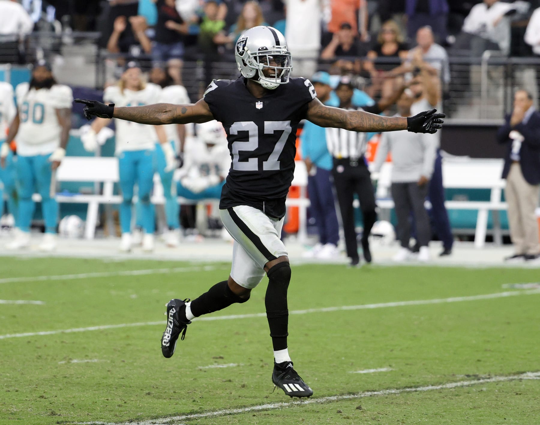 LAS VEGAS, NEVADA - SEPTEMBER 26:  Cornerback Trayvon Mullen Jr. #27 of the Las Vegas Raiders celebrates after breaking up a pass intended for wide receiver DeVante Parker #11 of the Miami Dolphins on a third-and-20 play during their game at Allegiant Stadium on September 26, 2021 in Las Vegas, Nevada. The Raiders defeated the Dolphins 31-28 in overtime.  (Photo by Ethan Miller/Getty Images)