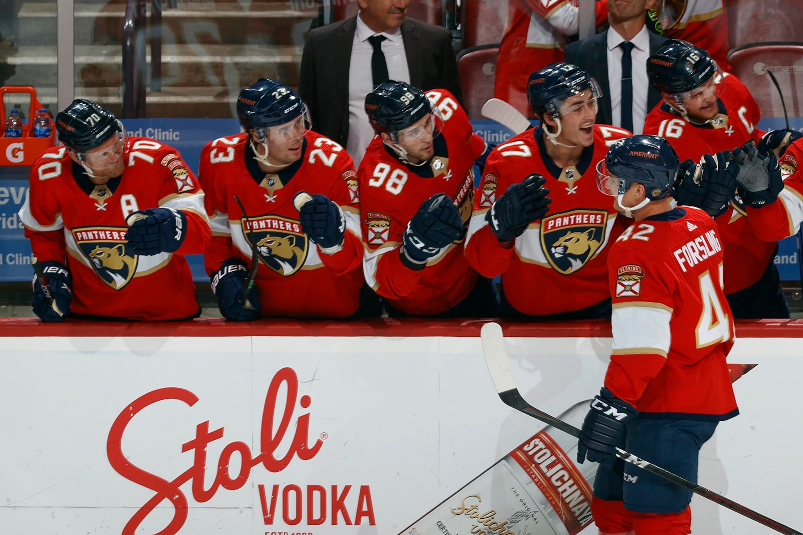 SUNRISE, FL - APRIL 15: Gustav Forsling #42 of the Florida Panthers skates by the bench and is congratulated by teammates after he scored a second period goal against the Winnipeg Jets at the FLA Live Arena on April 15, 2022 in Sunrise, Florida. (Photo by Joel Auerbach/Getty Images)