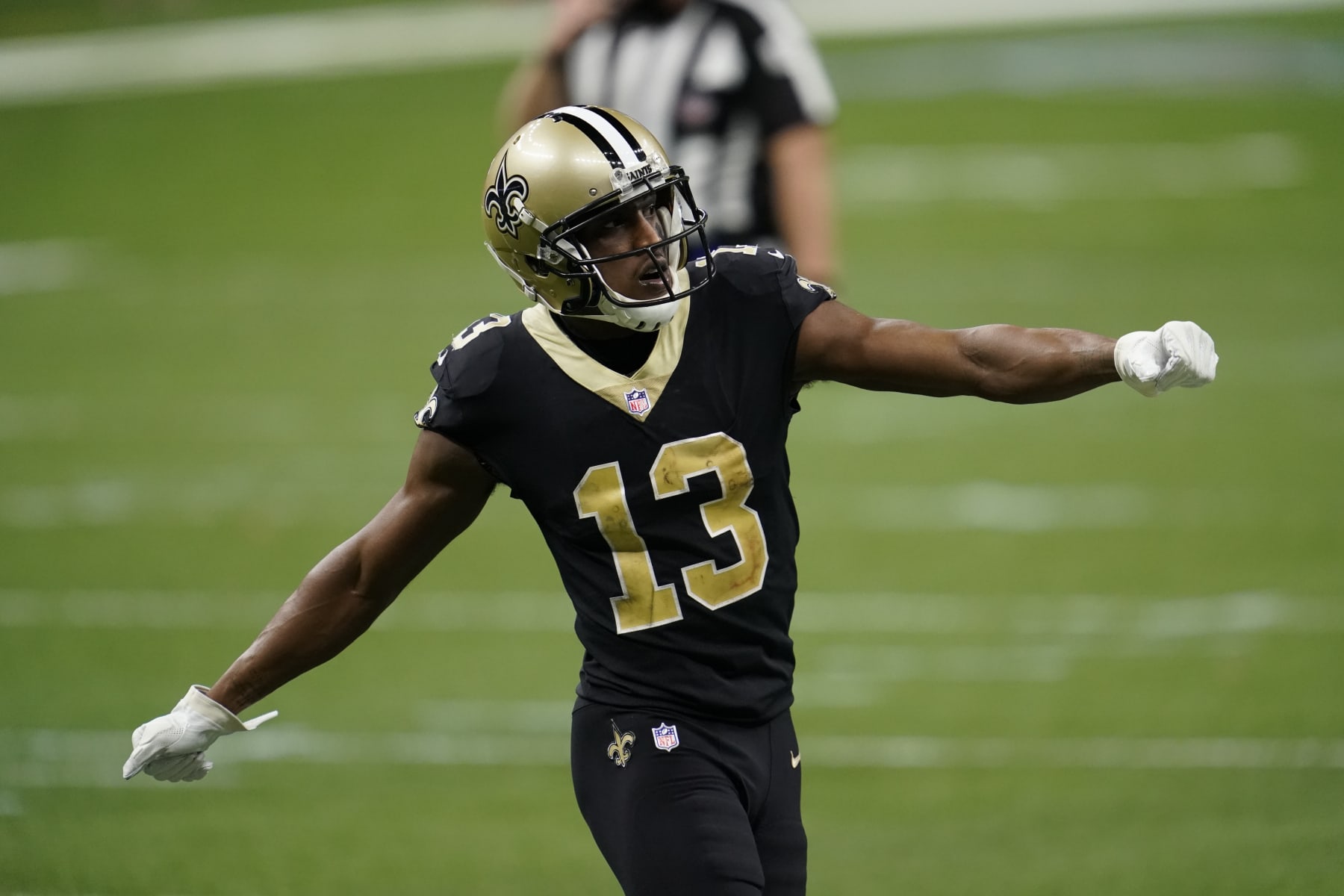 NEW ORLEANS, LOUISIANA - JANUARY 10: Michael Thomas #13 of the New Orleans Saints motions prior to the play during an NFL wild-card playoff football game against the Chicago Bears on January 10, 2021 in New Orleans, Louisiana. (Photo by Cooper Neill/Getty Images)
