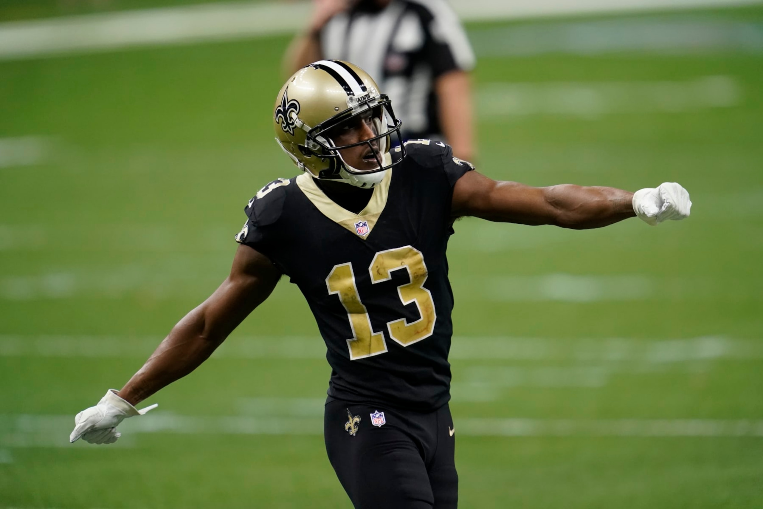 NEW ORLEANS, LOUISIANA - JANUARY 10: Michael Thomas #13 of the New Orleans Saints motions prior to the play during an NFL wild-card playoff football game against the Chicago Bears on January 10, 2021 in New Orleans, Louisiana. (Photo by Cooper Neill/Getty Images)