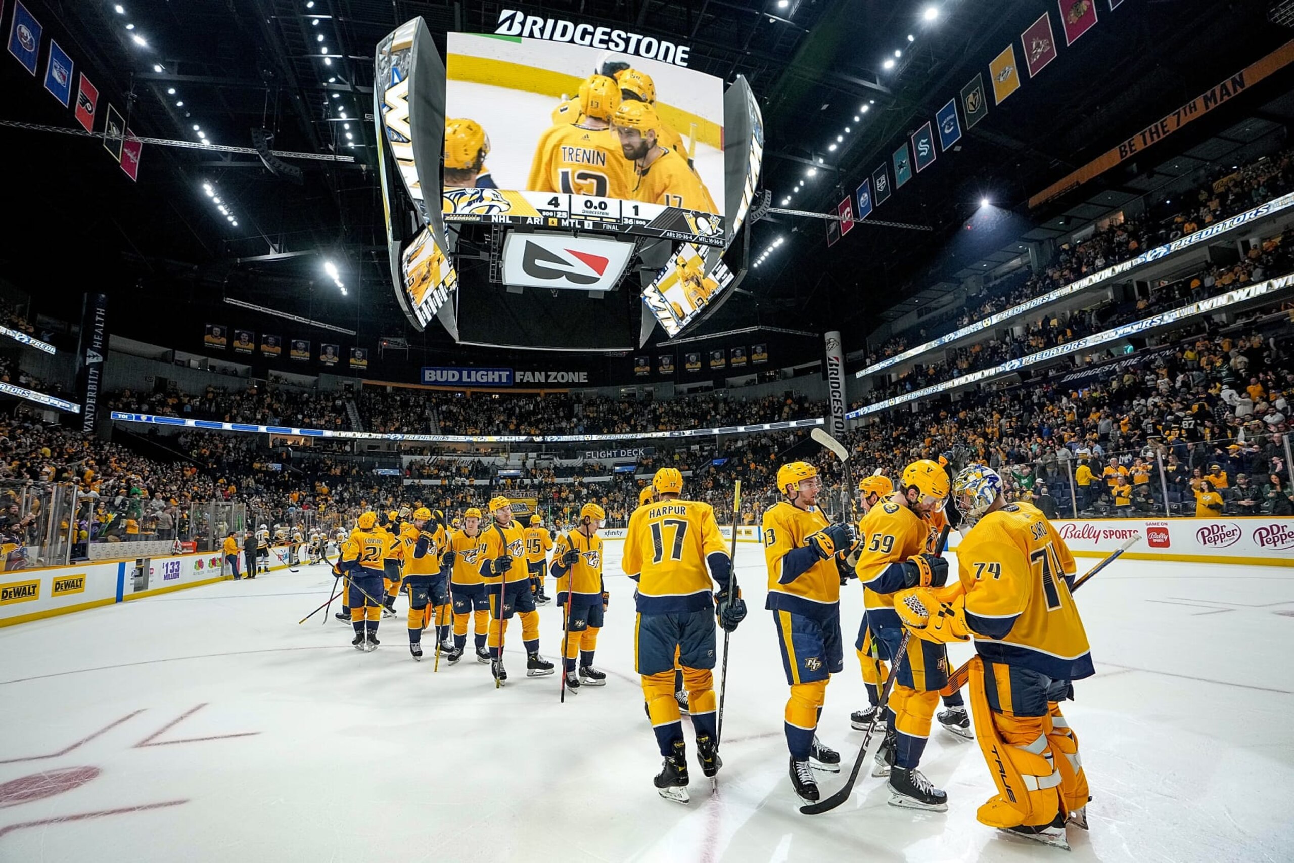 NASHVILLE, TN - MARCH 15: Roman Josi #59 congratulates Juuse Saros #74 of the Nashville Predators on a 4-1 win against the Pittsburgh Penguins during an NHL game at Bridgestone Arena on March 15, 2022 in Nashville, Tennessee. (Photo by John Russell/NHLI via Getty Images)