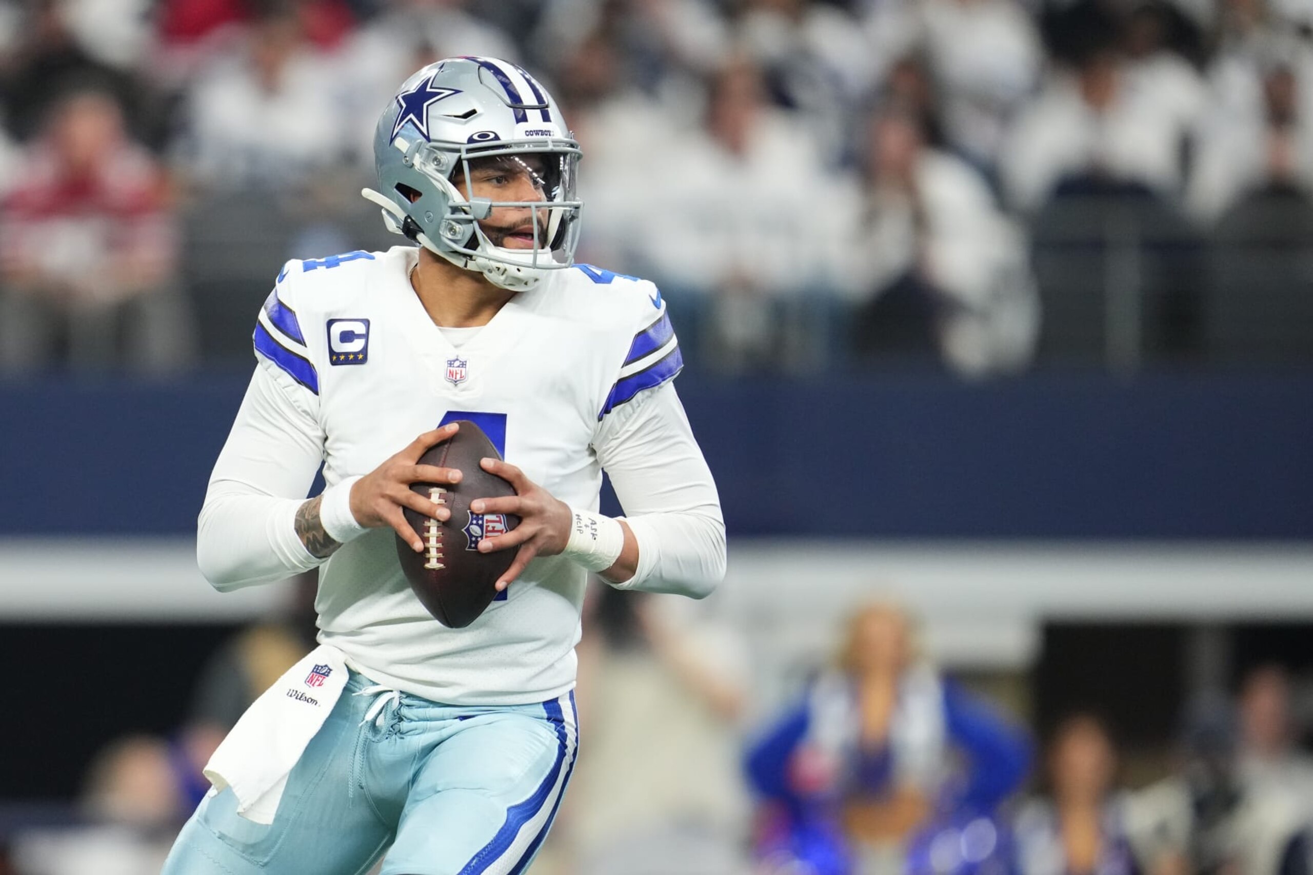 ARLINGTON, TEXAS - JANUARY 16: Dak Prescott #4 of the Dallas Cowboys drops back against the San Francisco 49ers during an NFL wild-card playoff football game at AT&T Stadium on January 16, 2022 in Arlington, Texas.  (Photo by Cooper Neill/Getty Images)