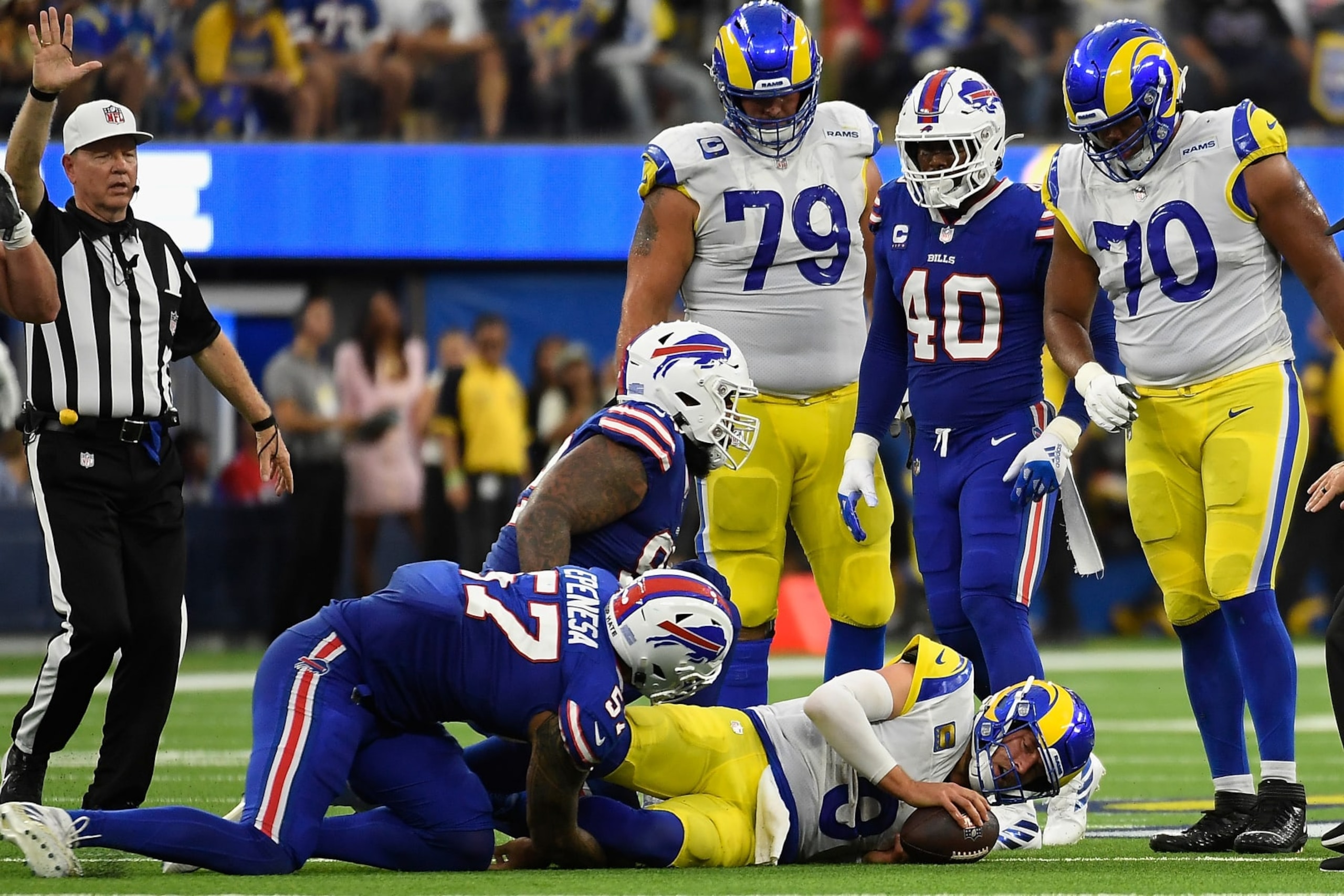 INGLEWOOD, CALIFORNIA - SEPTEMBER 08:  Quarterback Matthew Stafford #9 of the Los Angeles Rams is sacked by defensive end AJ Epenesa #57 of the Buffalo Bills during the second quarter of the NFL game at SoFi Stadium on September 08, 2022 in Inglewood, California. (Photo by Kevork Djansezian/Getty Images)